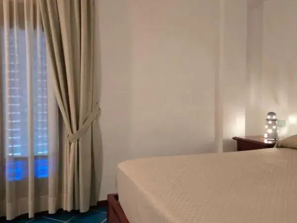 Bed in Hotel Pisacane Bed in Hotel Pisacane