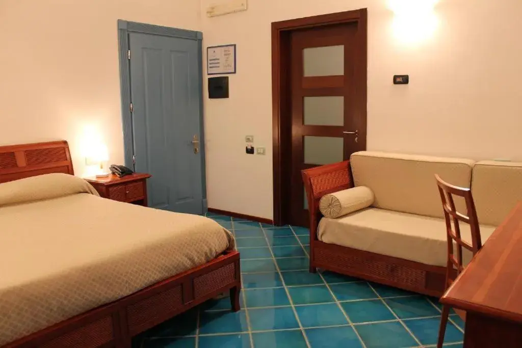 Bed in Hotel Pisacane Bed in Hotel Pisacane