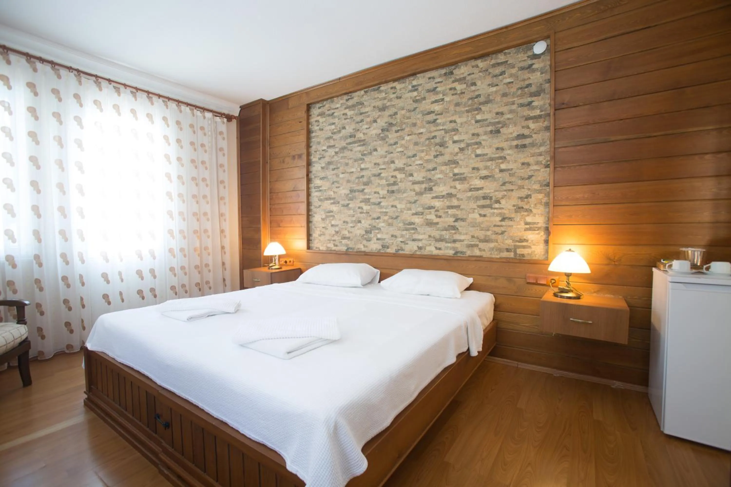 Bed in Dedeminn Garden Hotel