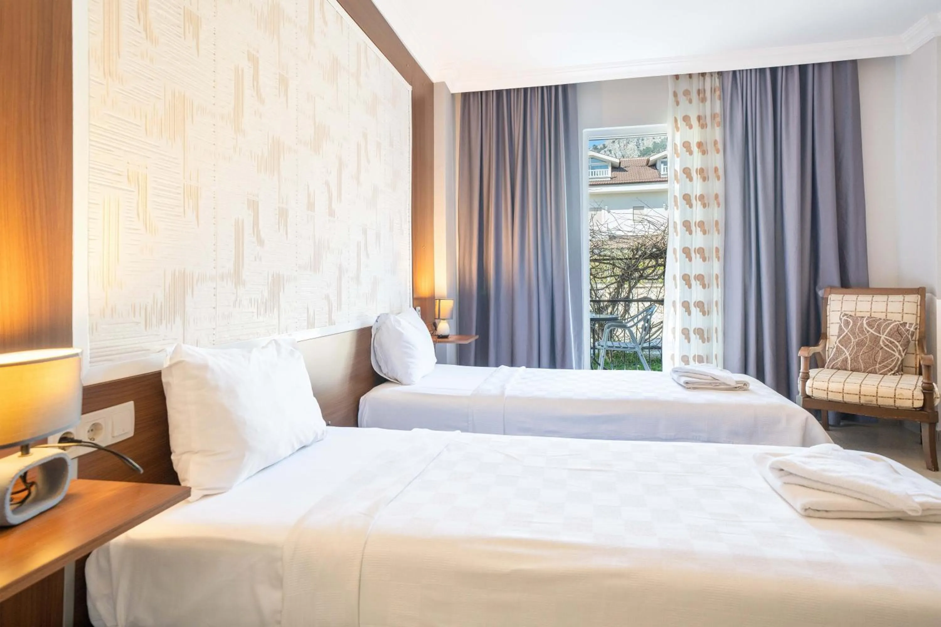 Bed in Dedeminn Garden Hotel