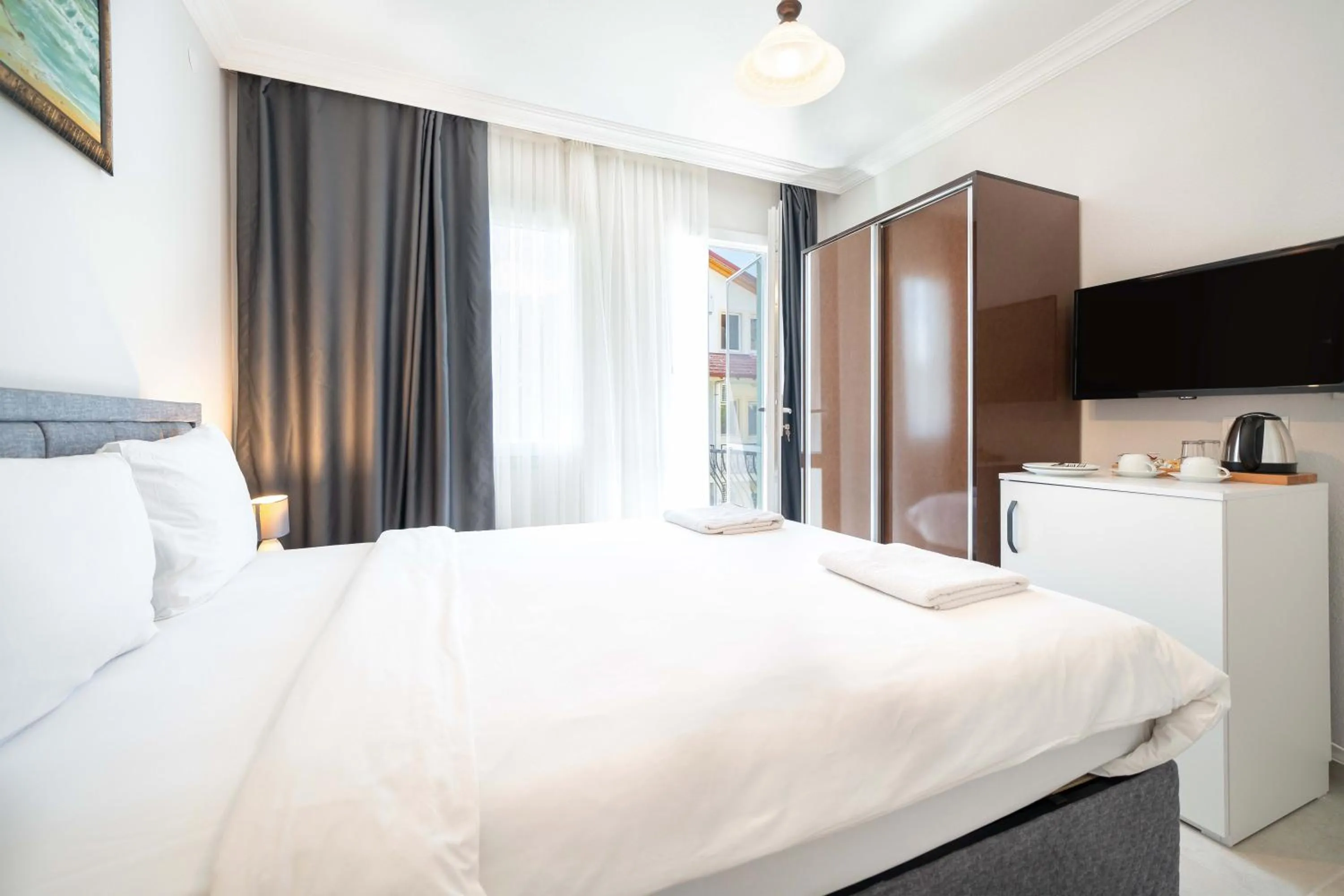 Bed in Dedeminn Garden Hotel