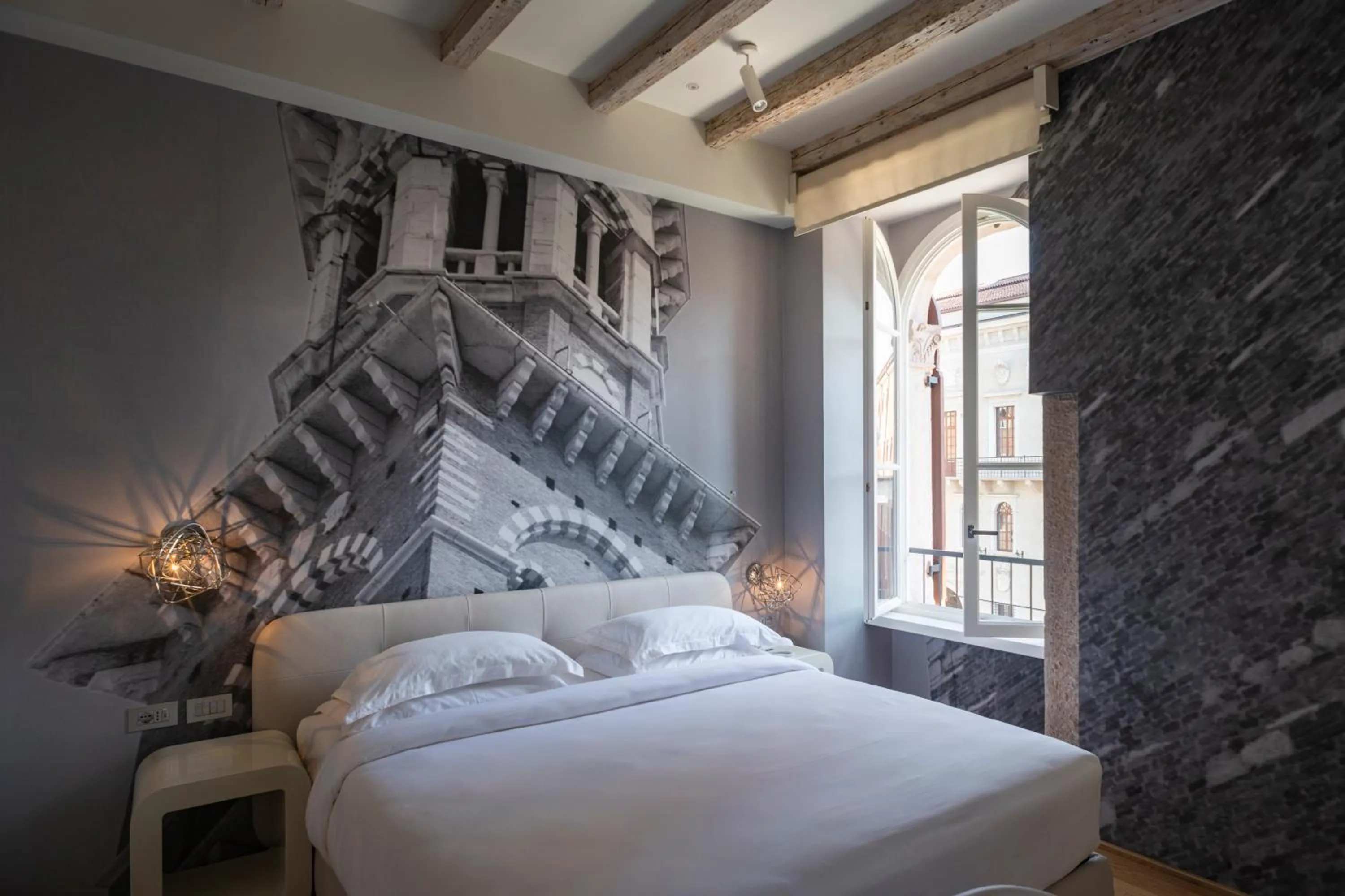 Bed in Lords of Verona Luxury Apartments