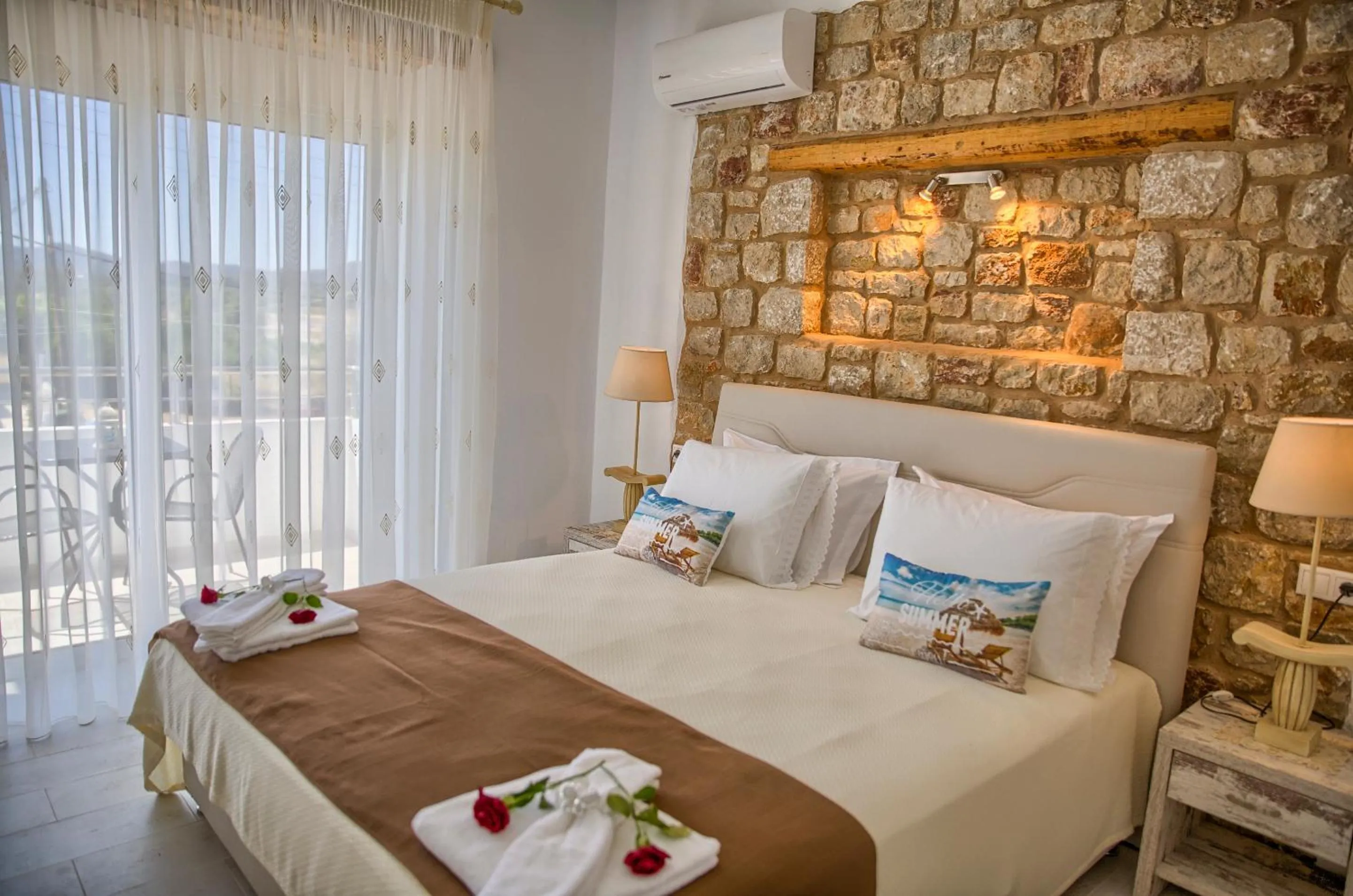 Bed in Haraki Stone Apartments