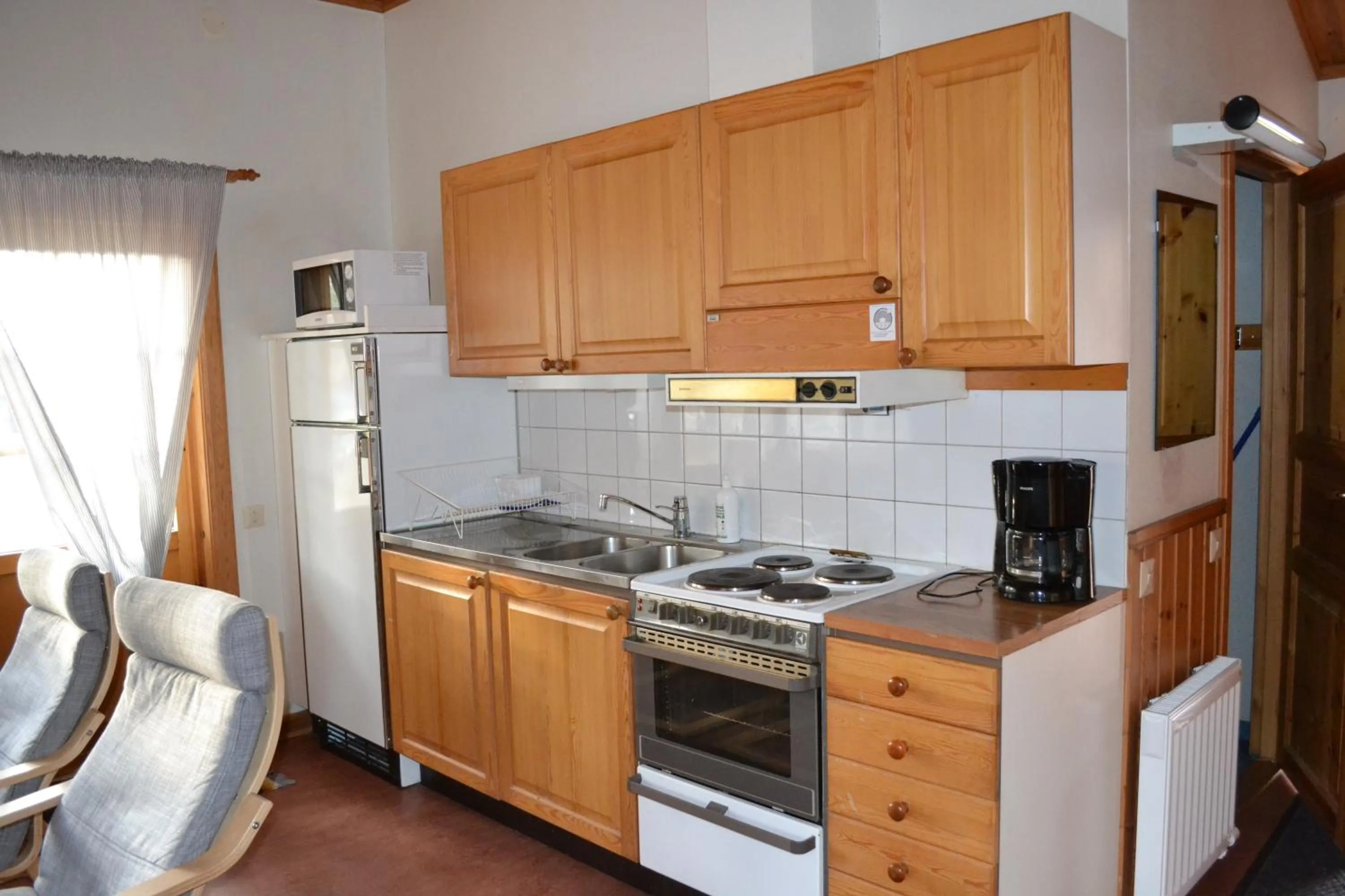 Kitchen or kitchenette in First Camp Enåbadet - Rättvik