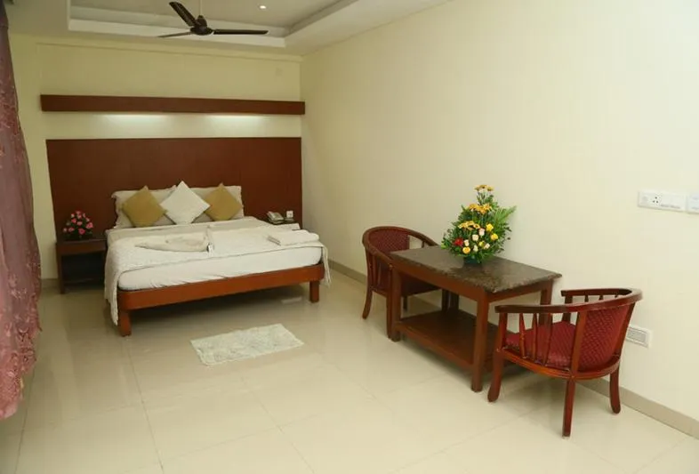 Bedroom, Bed in Dhanunjayas Luxury Hotel