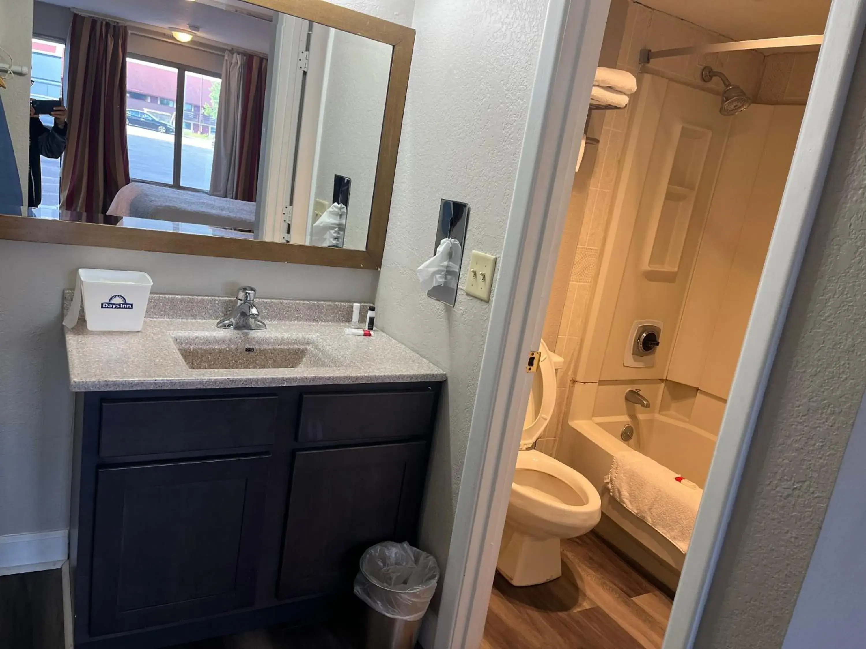 Bathroom in Days Inn & Suites by Wyndham Dayton North