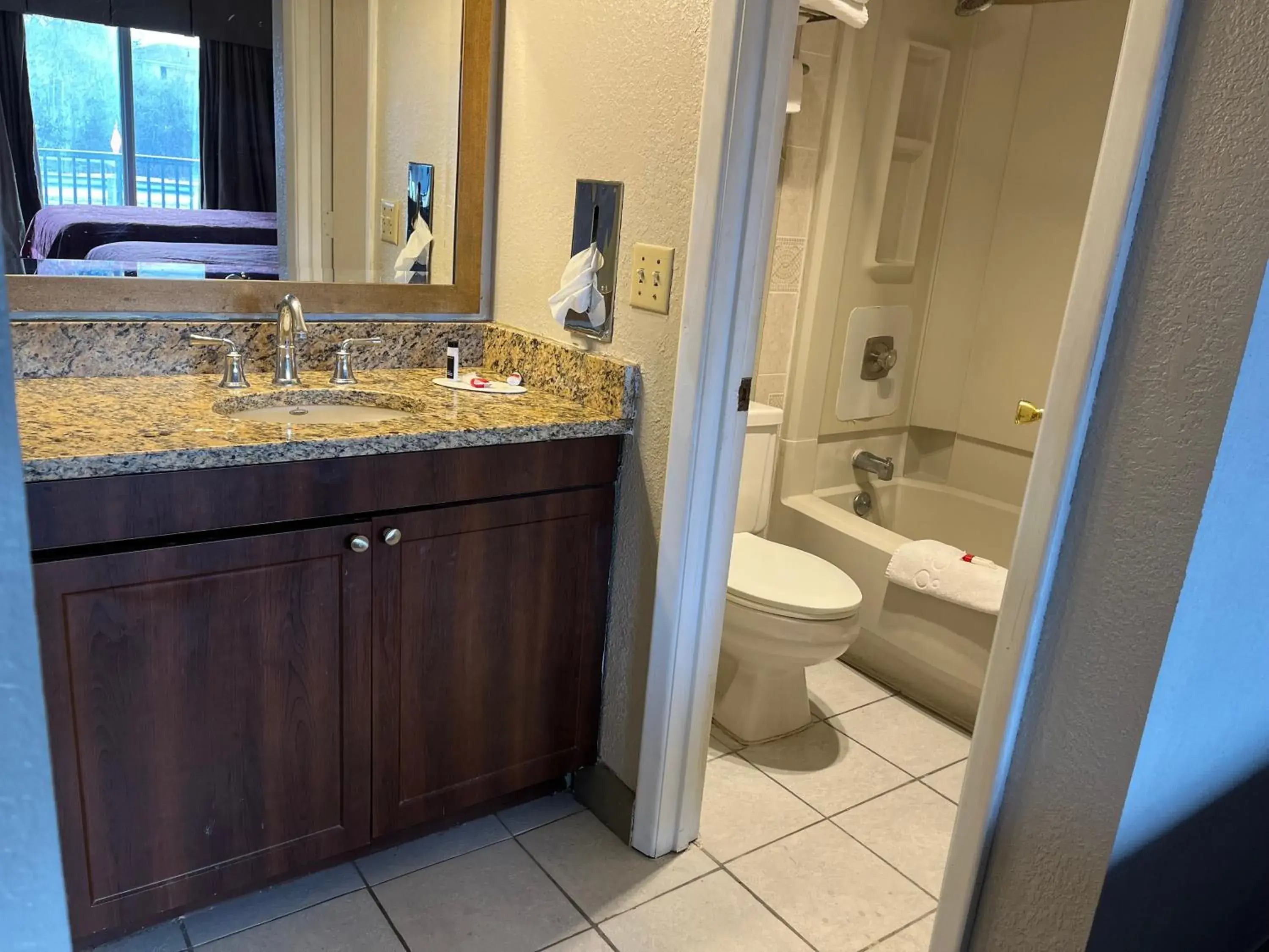 Bathroom in Days Inn & Suites by Wyndham Dayton North