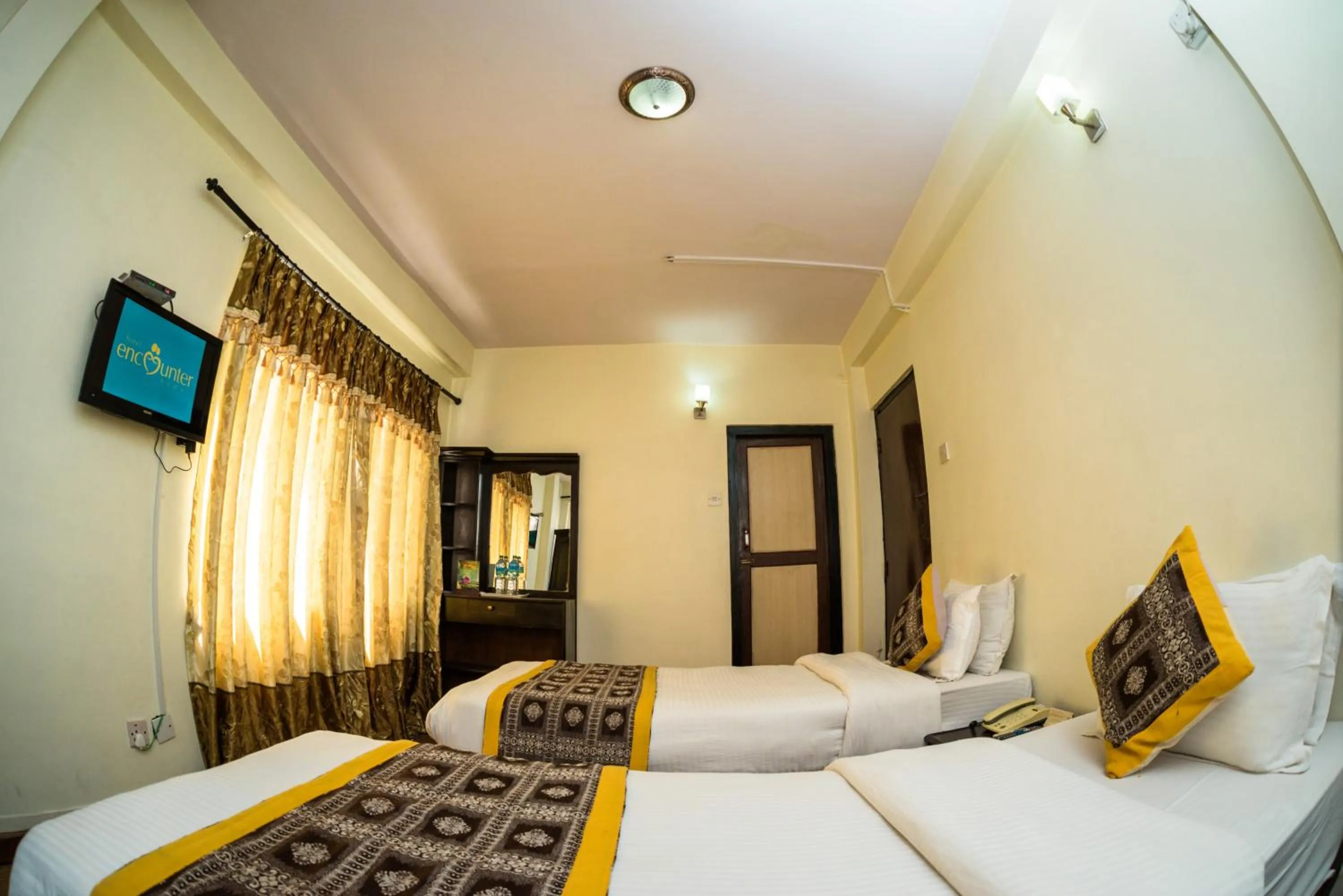 Bed in Hotel Encounter Nepal & Spa