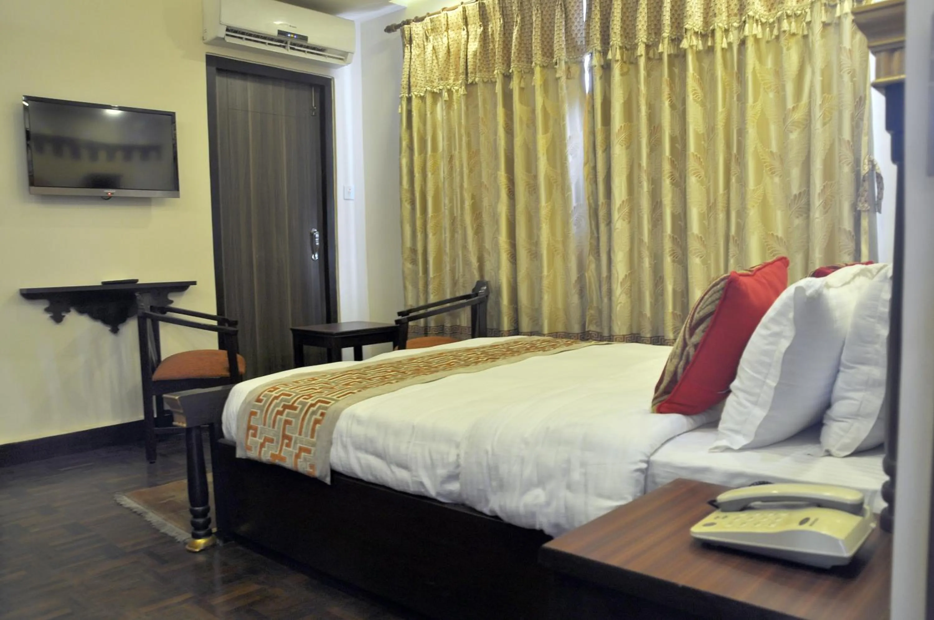 Bed in Hotel Encounter Nepal & Spa