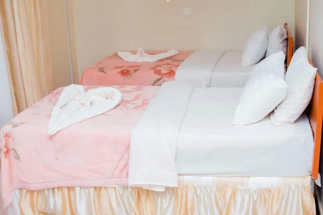 Bed in Kilimanjaro Crane Hotels & Safaris
