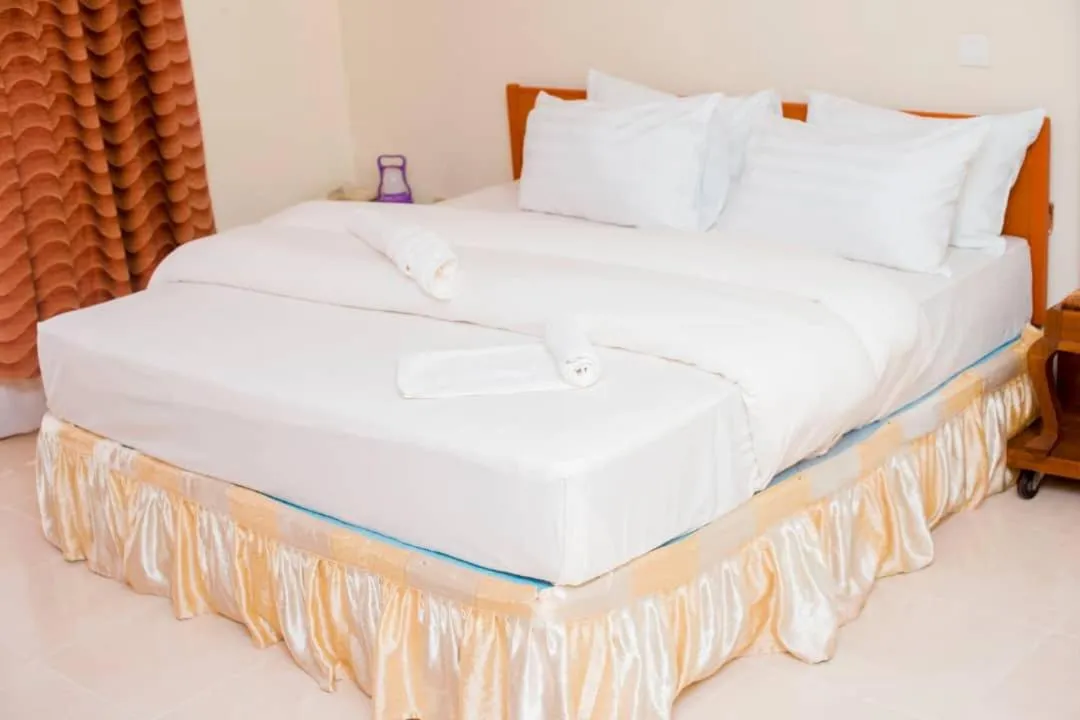Bed in Kilimanjaro Crane Hotels & Safaris