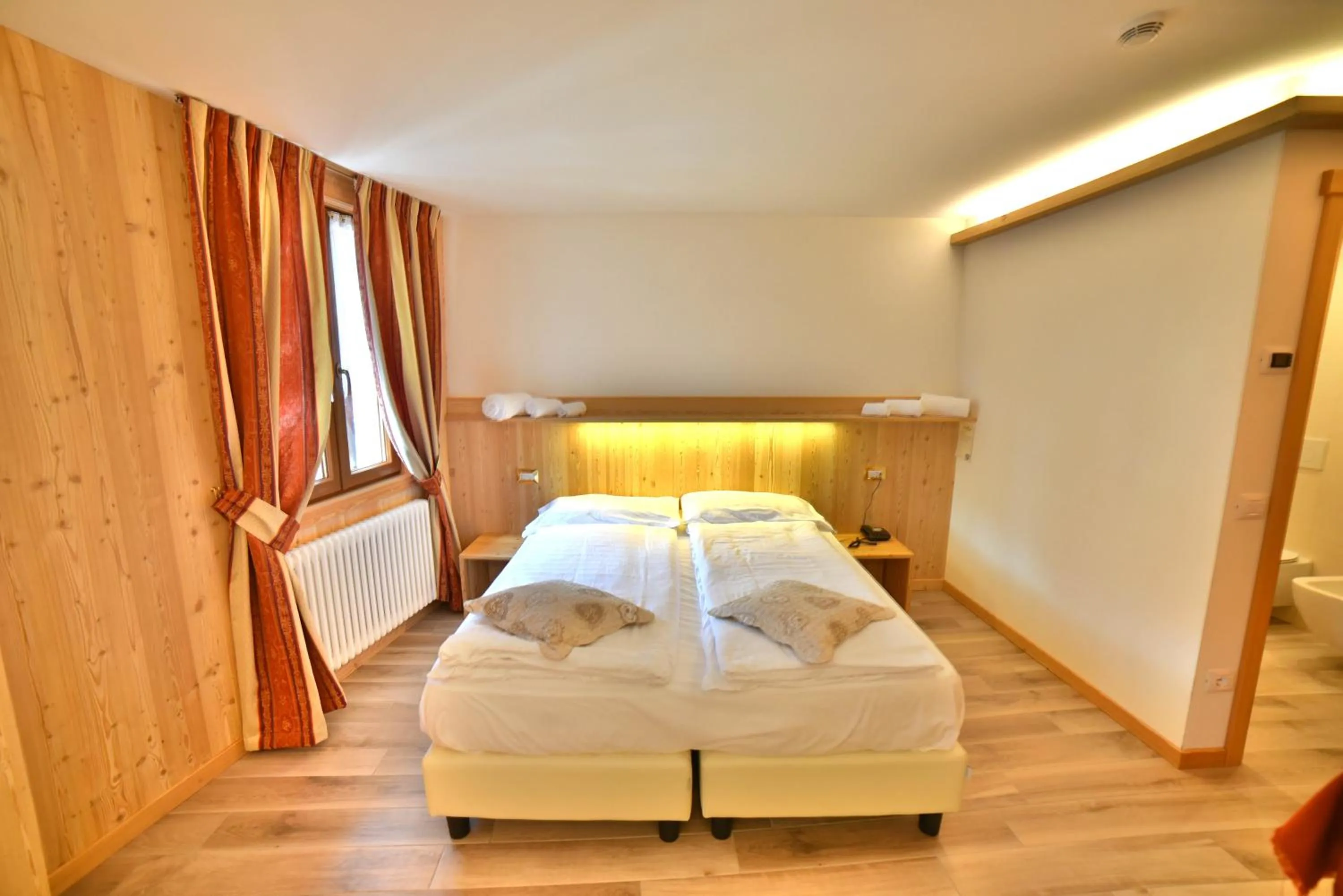 Bed in Albergo Stelvio