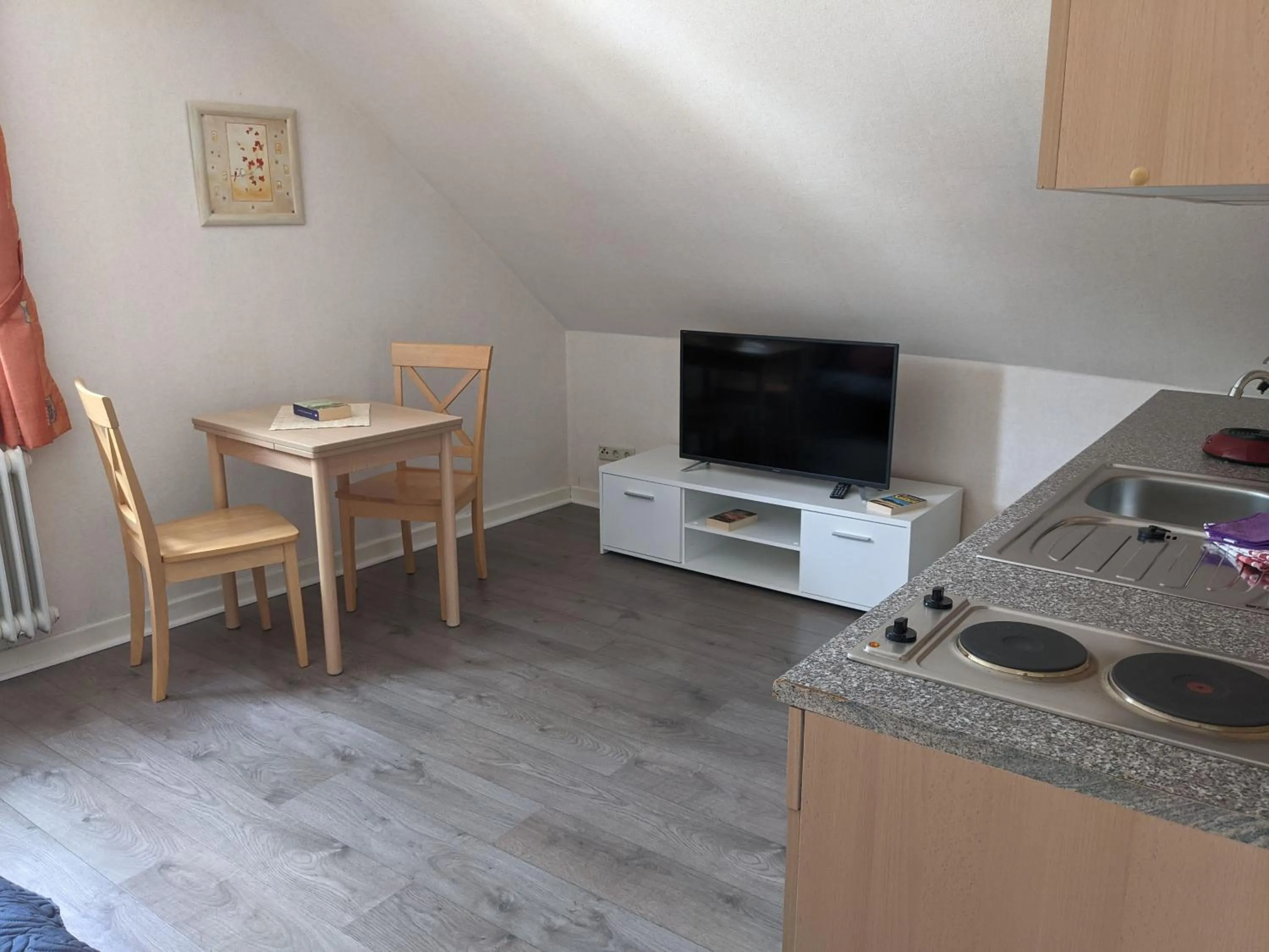 Communal lounge/ TV room in Gaestehaus Gaes