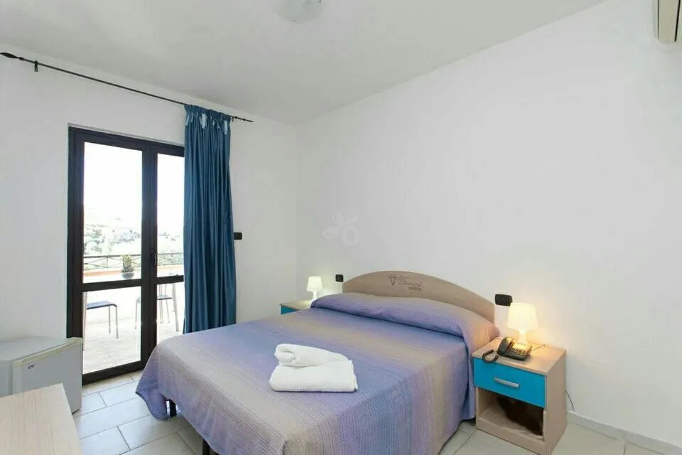 Bed in Hotel Diamond Residence