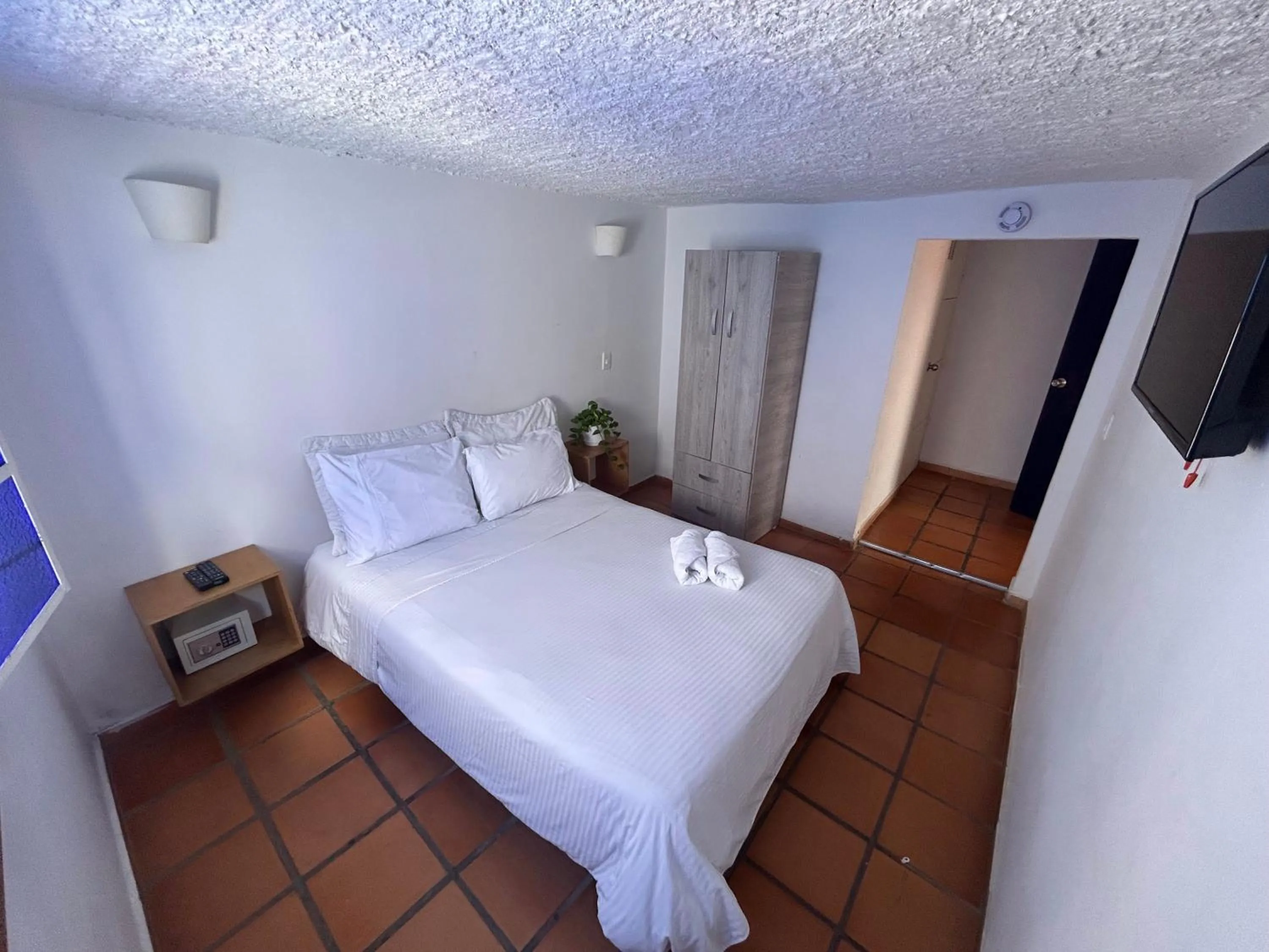 Communal lounge/ TV room, Bed in Zana Hotel Boutique