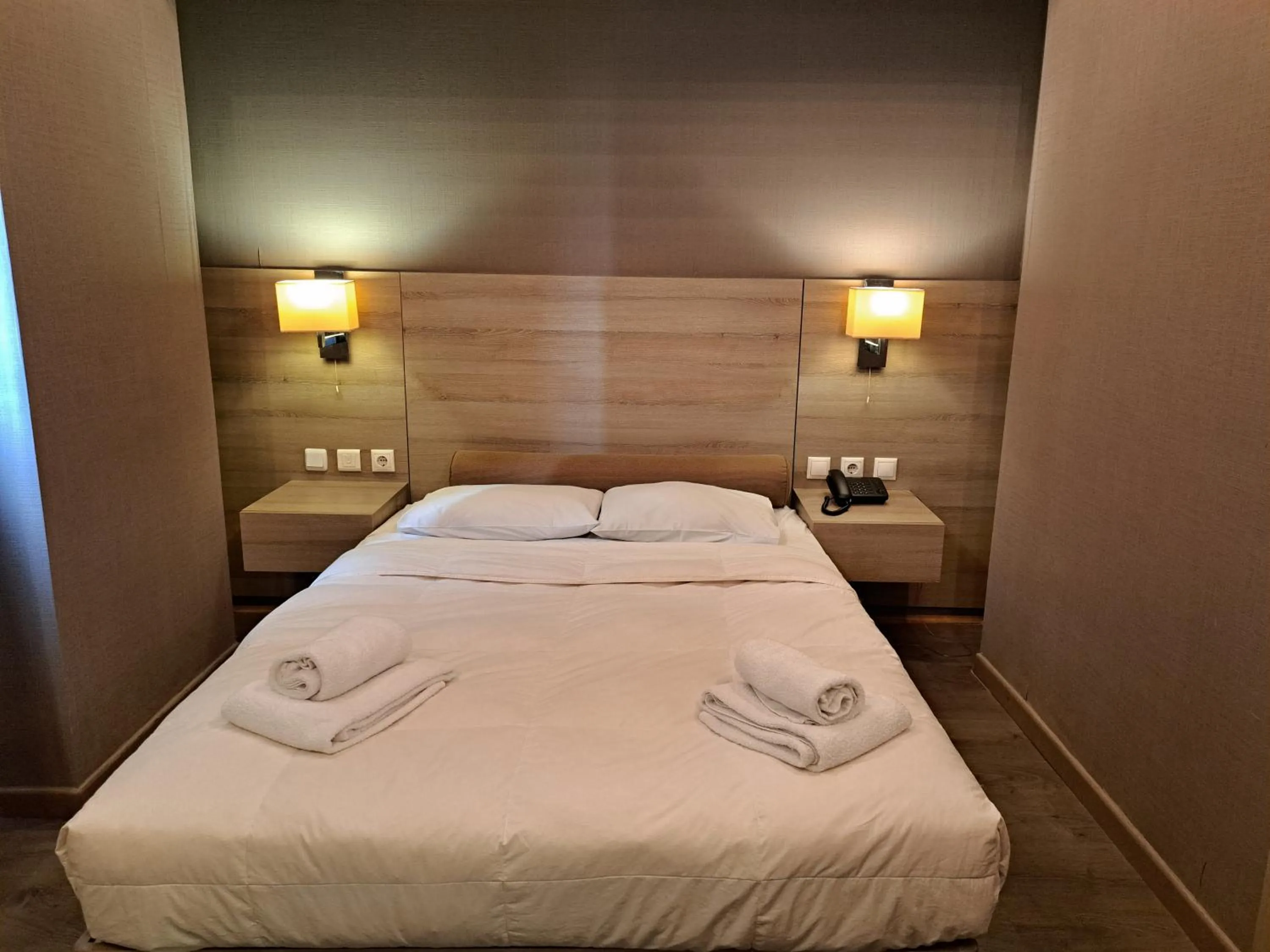 Bed in Nefeli Hotel Alimos