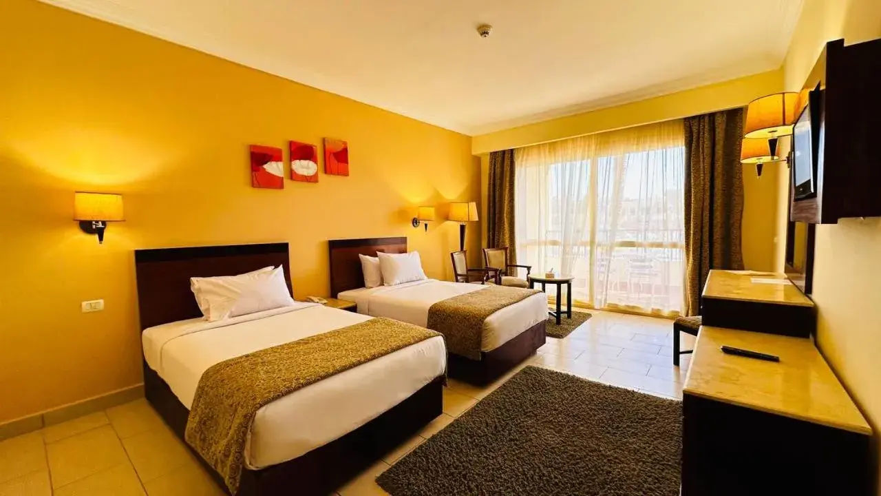 Communal lounge/ TV room, Bed in Regency Plaza Aqua Park and Spa Resort Communal lounge/ TV room, Bed in Regency Plaza Aqua Park and Spa Resort