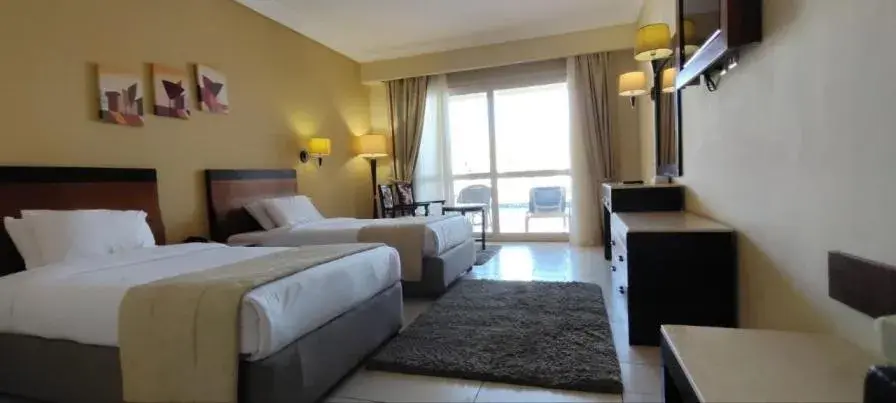 Communal lounge/ TV room, Bed in Regency Plaza Aqua Park and Spa Resort Communal lounge/ TV room, Bed in Regency Plaza Aqua Park and Spa Resort