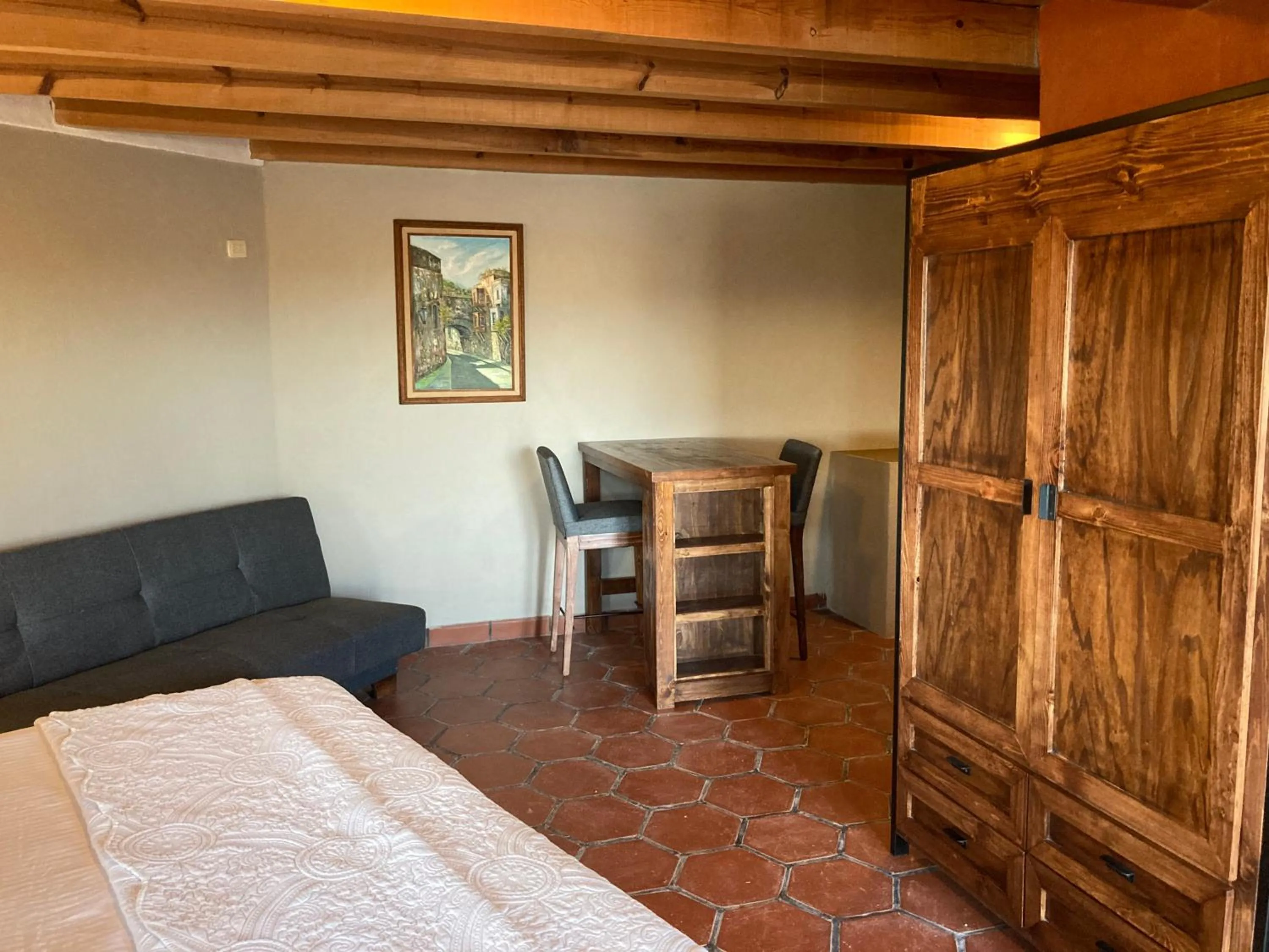 Seating area, Bed in Gran Despertar El Faro