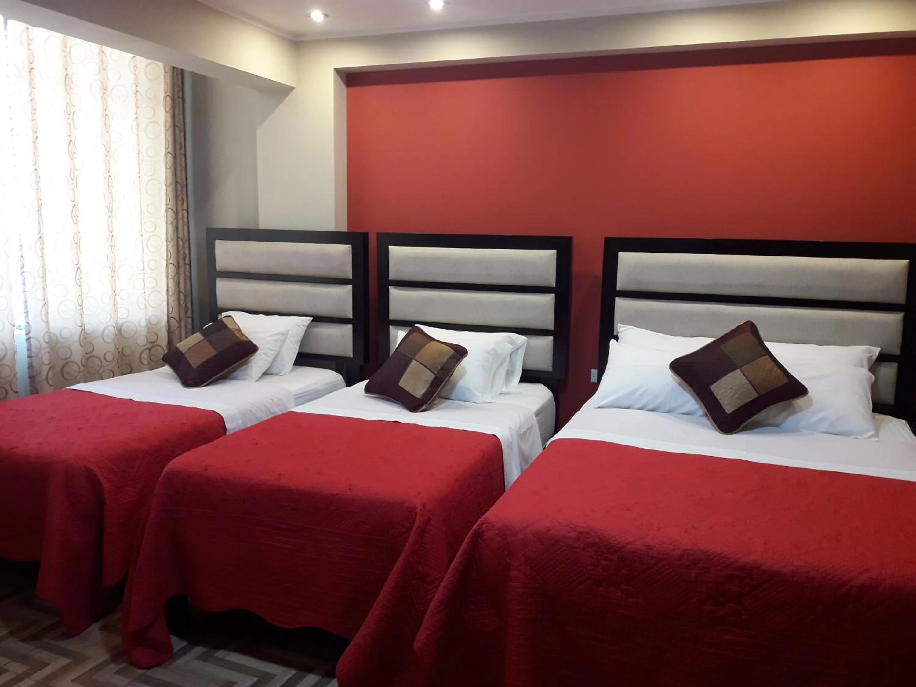 Bed in Gavina Inn Hotel