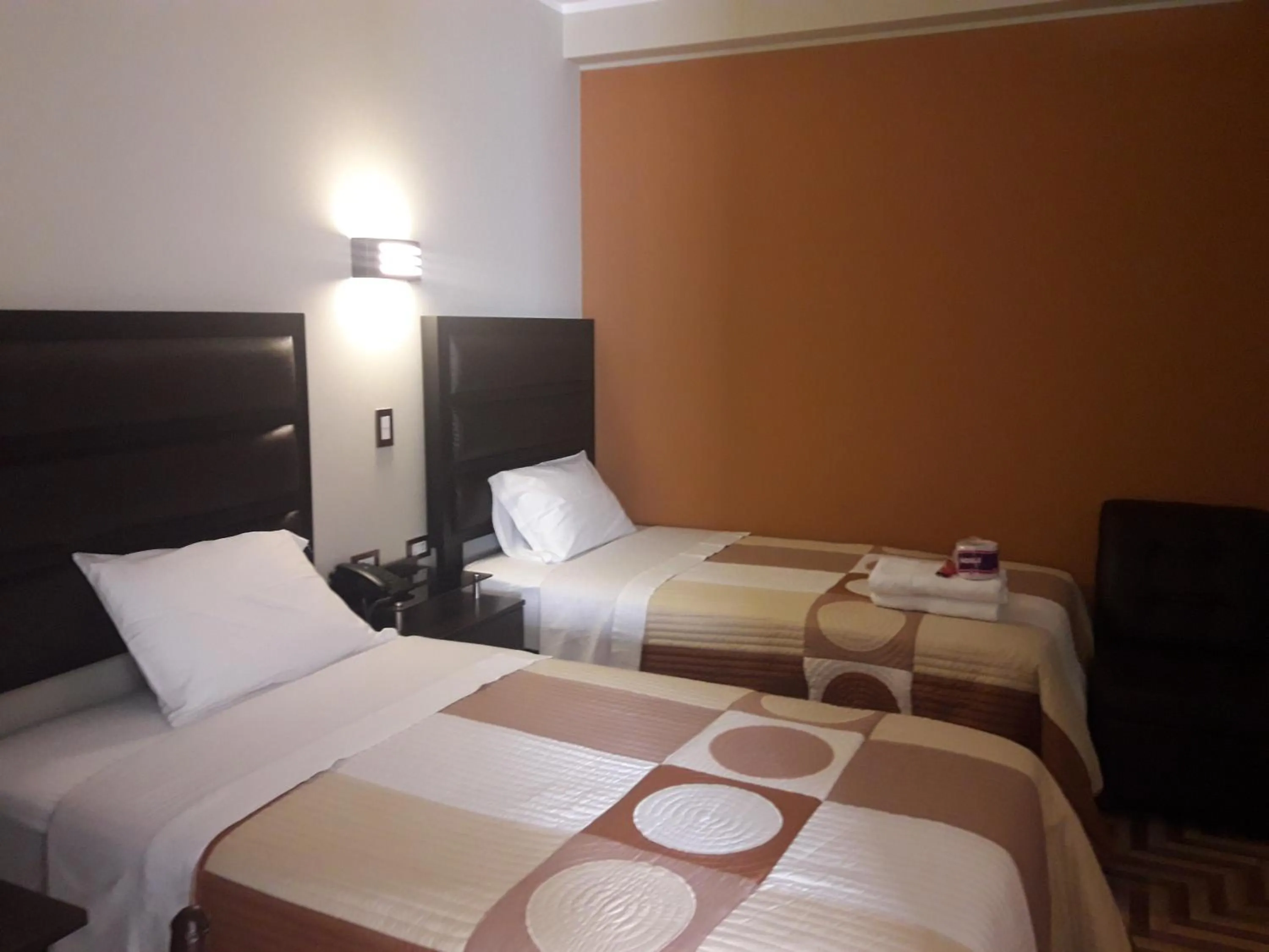 Bed in Gavina Inn Hotel