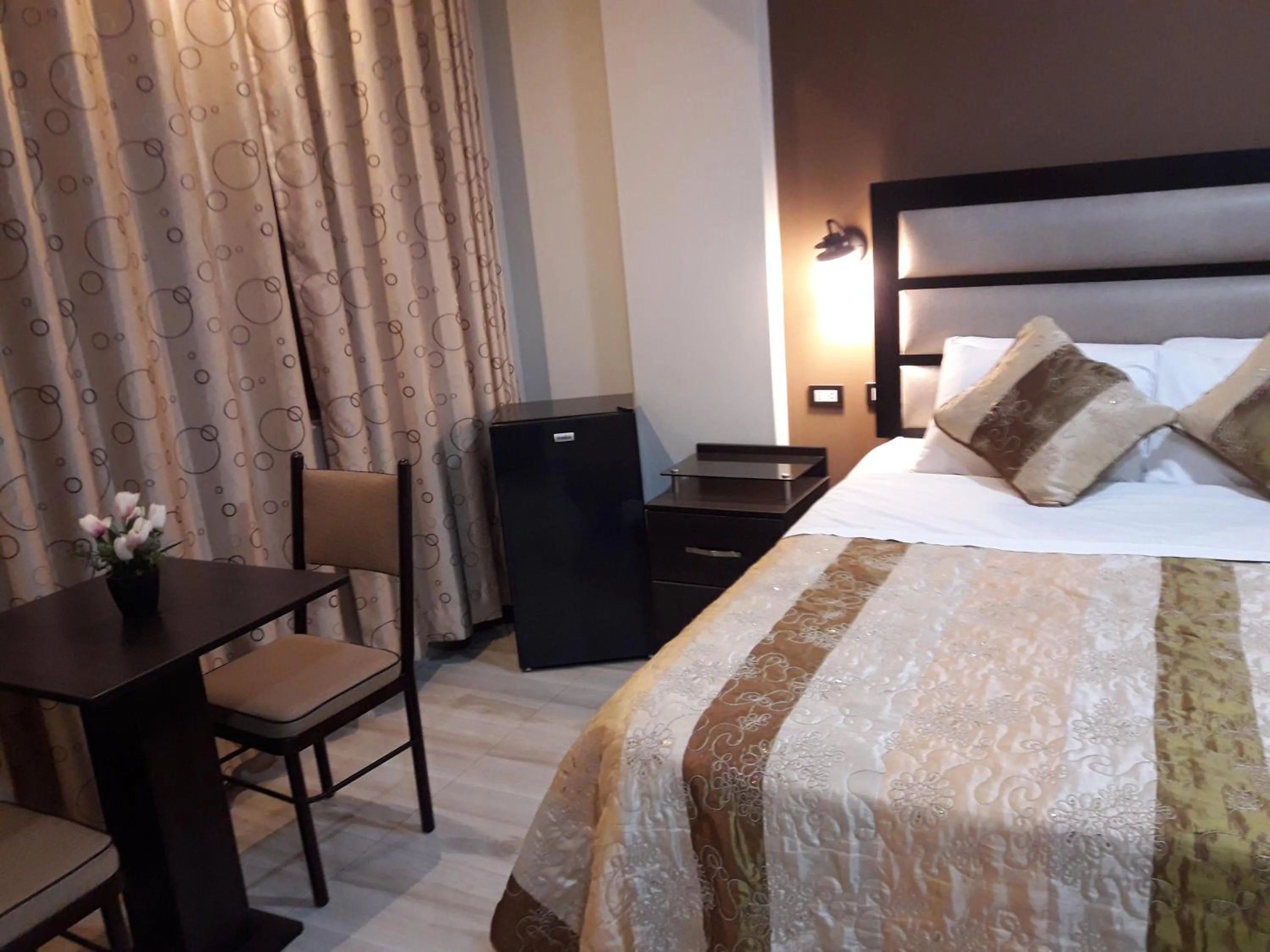 Bed in Gavina Inn Hotel