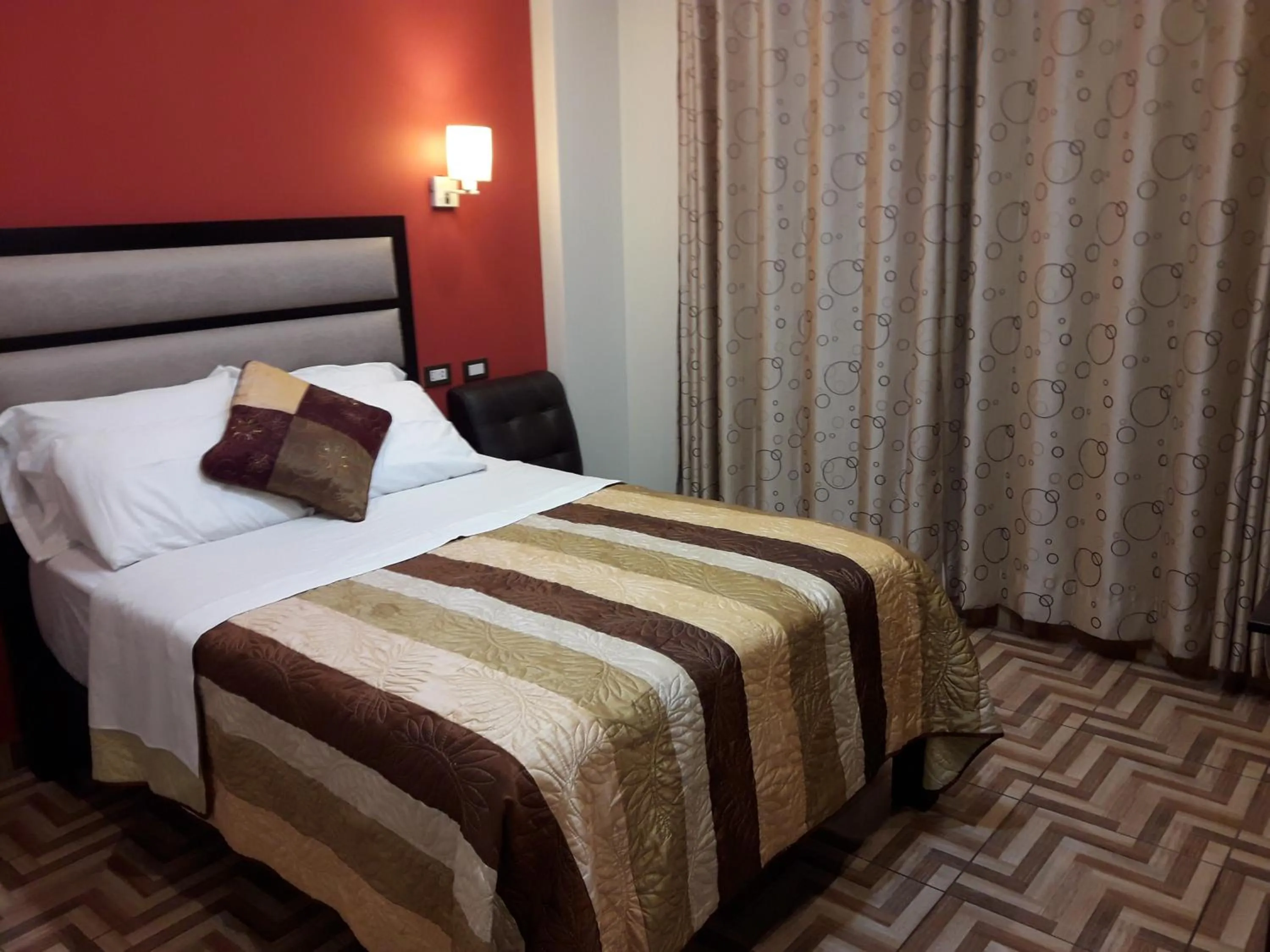 Bed in Gavina Inn Hotel