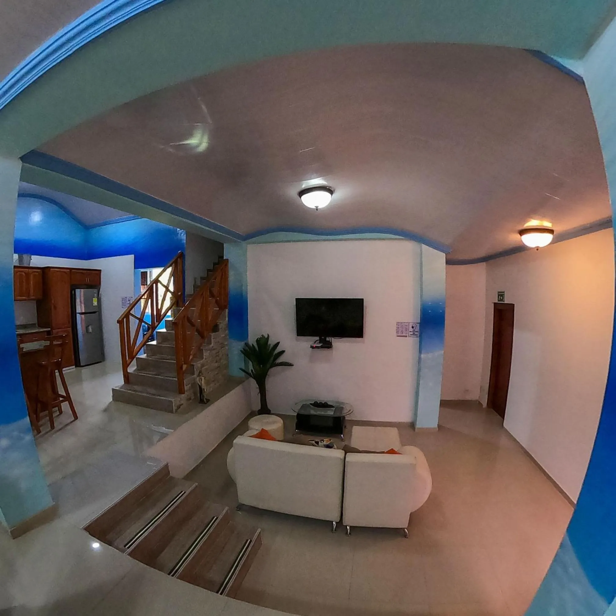 Communal lounge/ TV room in Posada Faych House