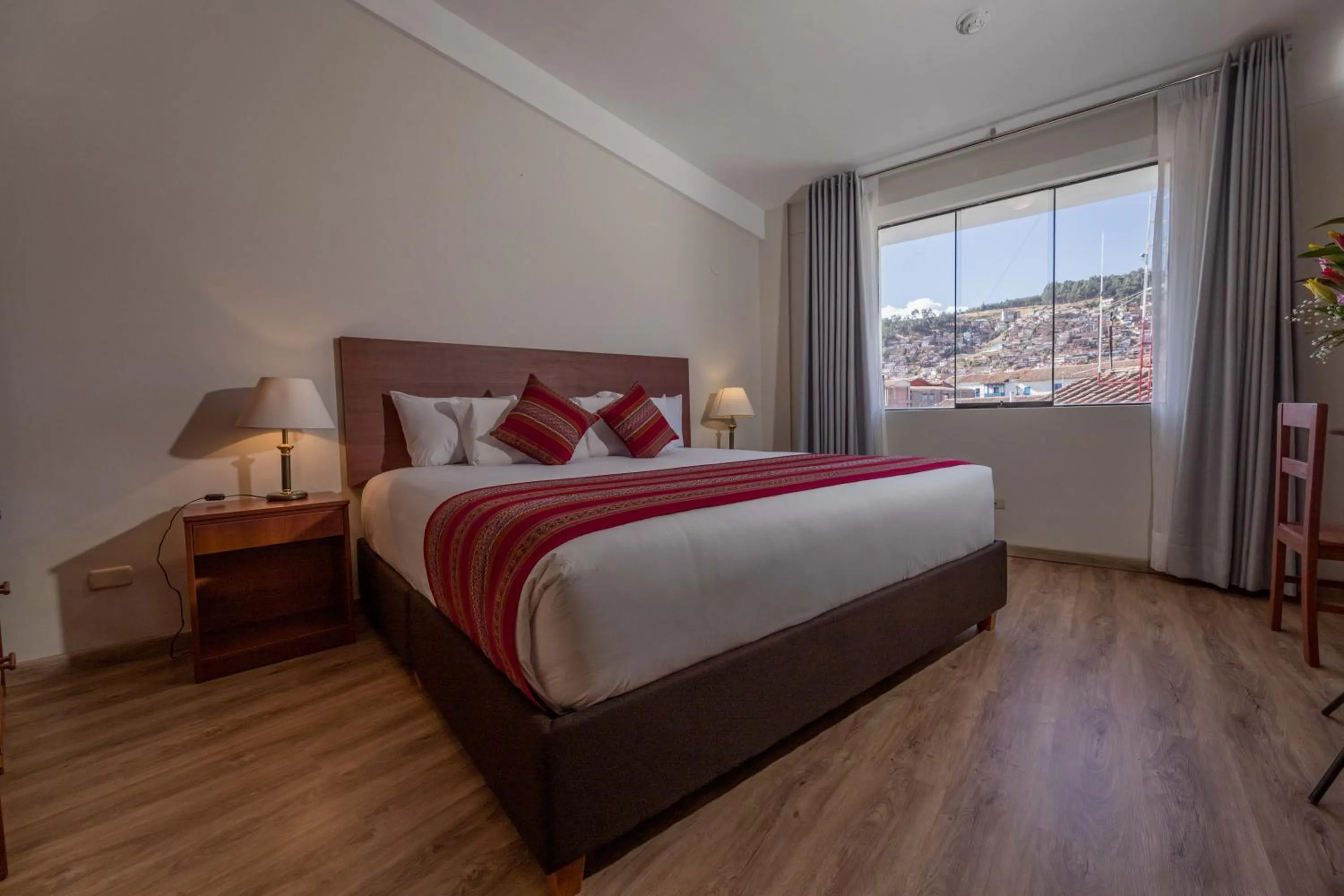 Bed in Quechua Plaza Hotel