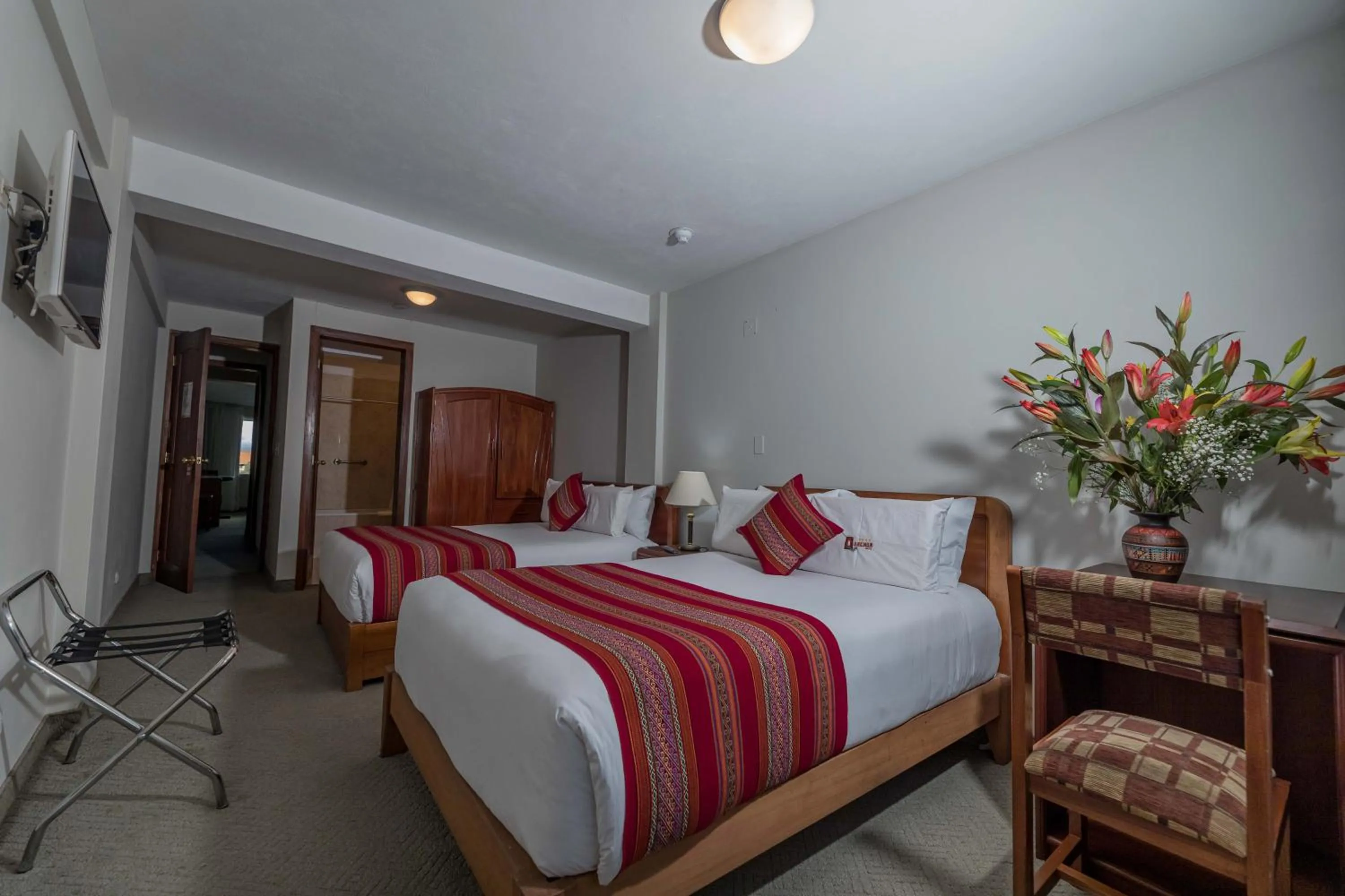 Bed in Quechua Plaza Hotel