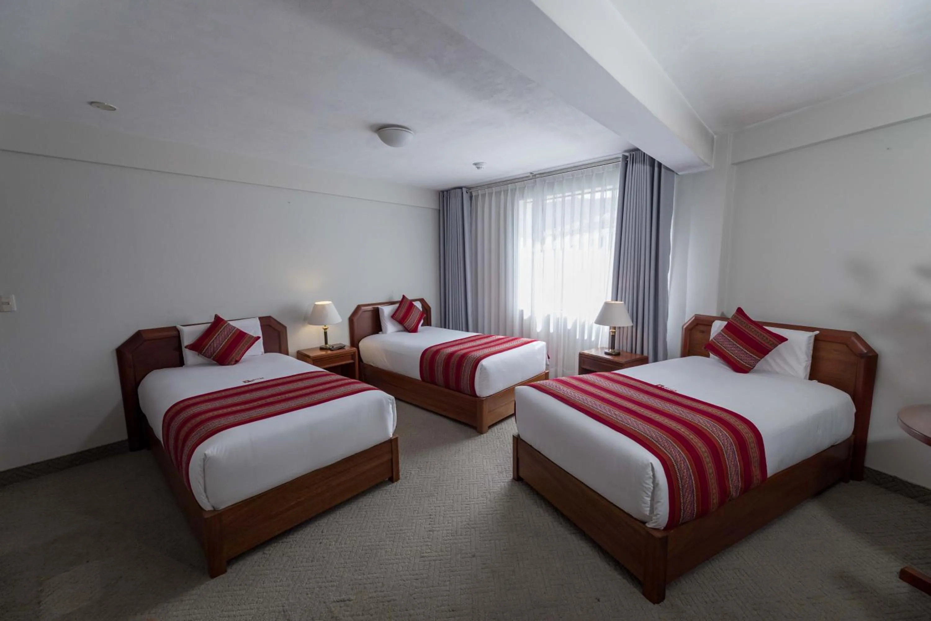 Bed in Quechua Plaza Hotel