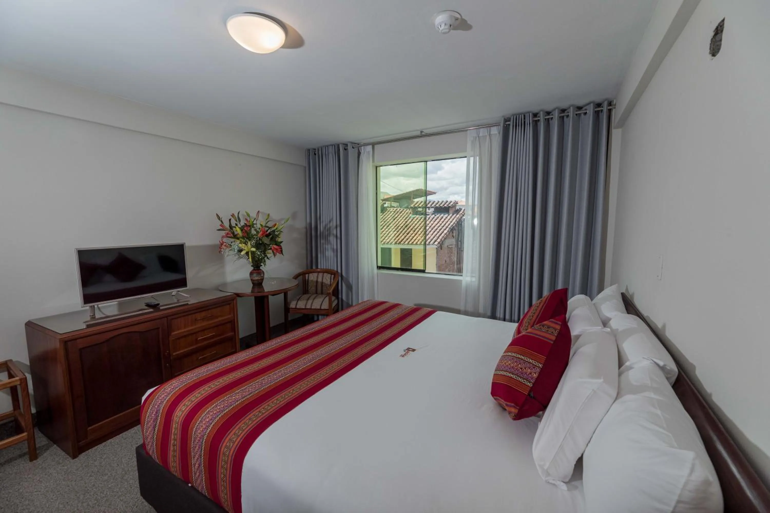 Bed in Quechua Plaza Hotel