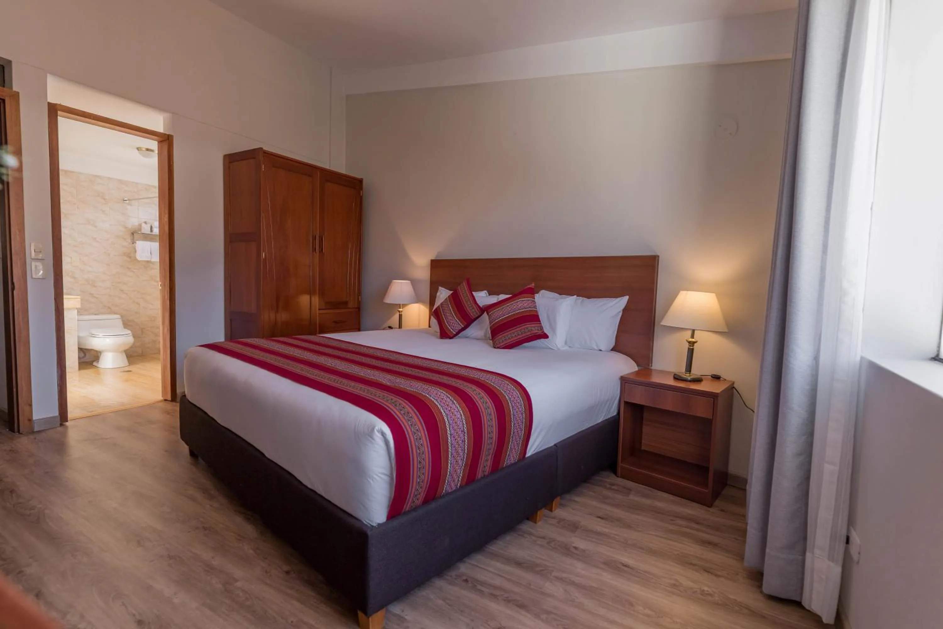 Bed in Quechua Plaza Hotel