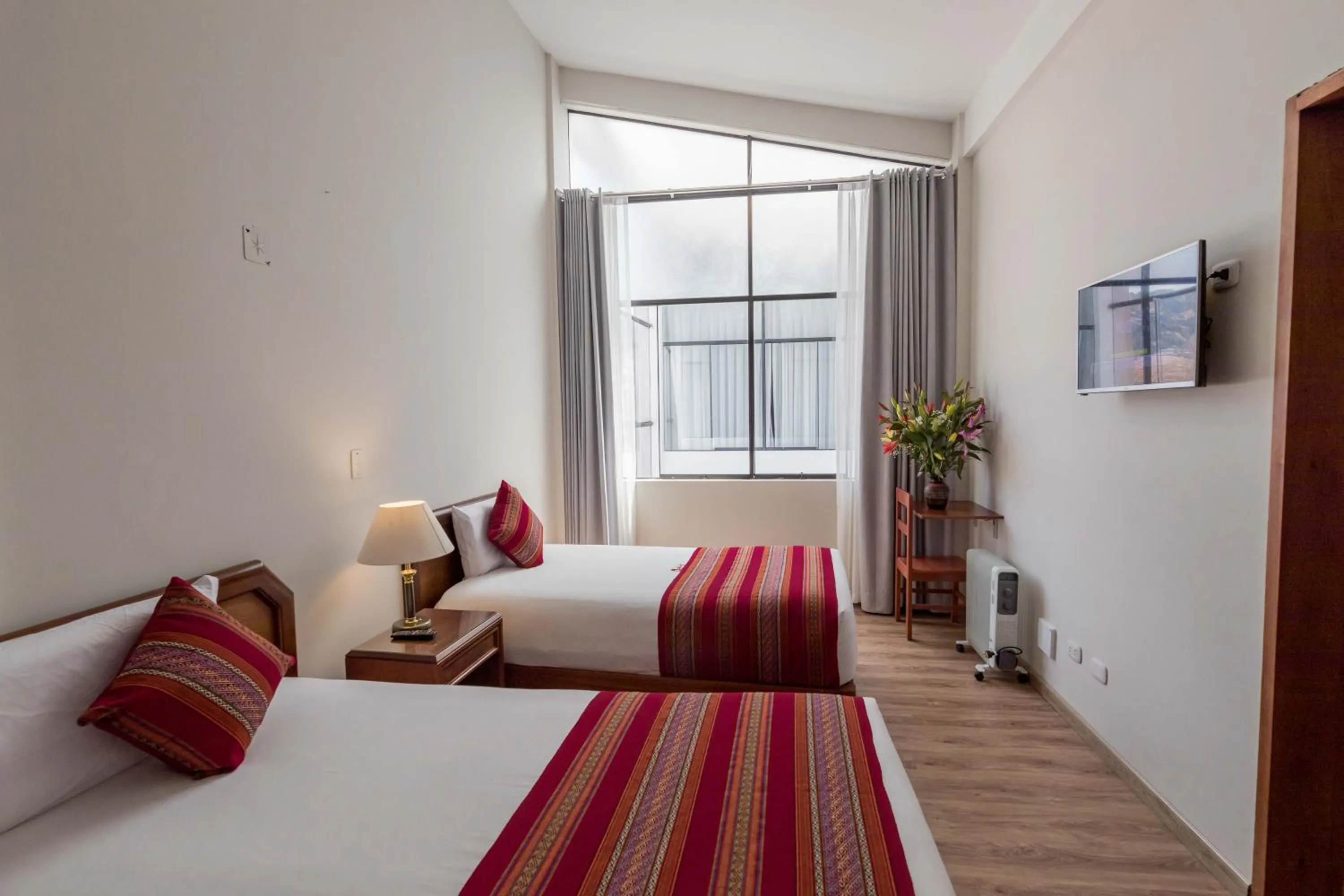 Bed in Quechua Plaza Hotel