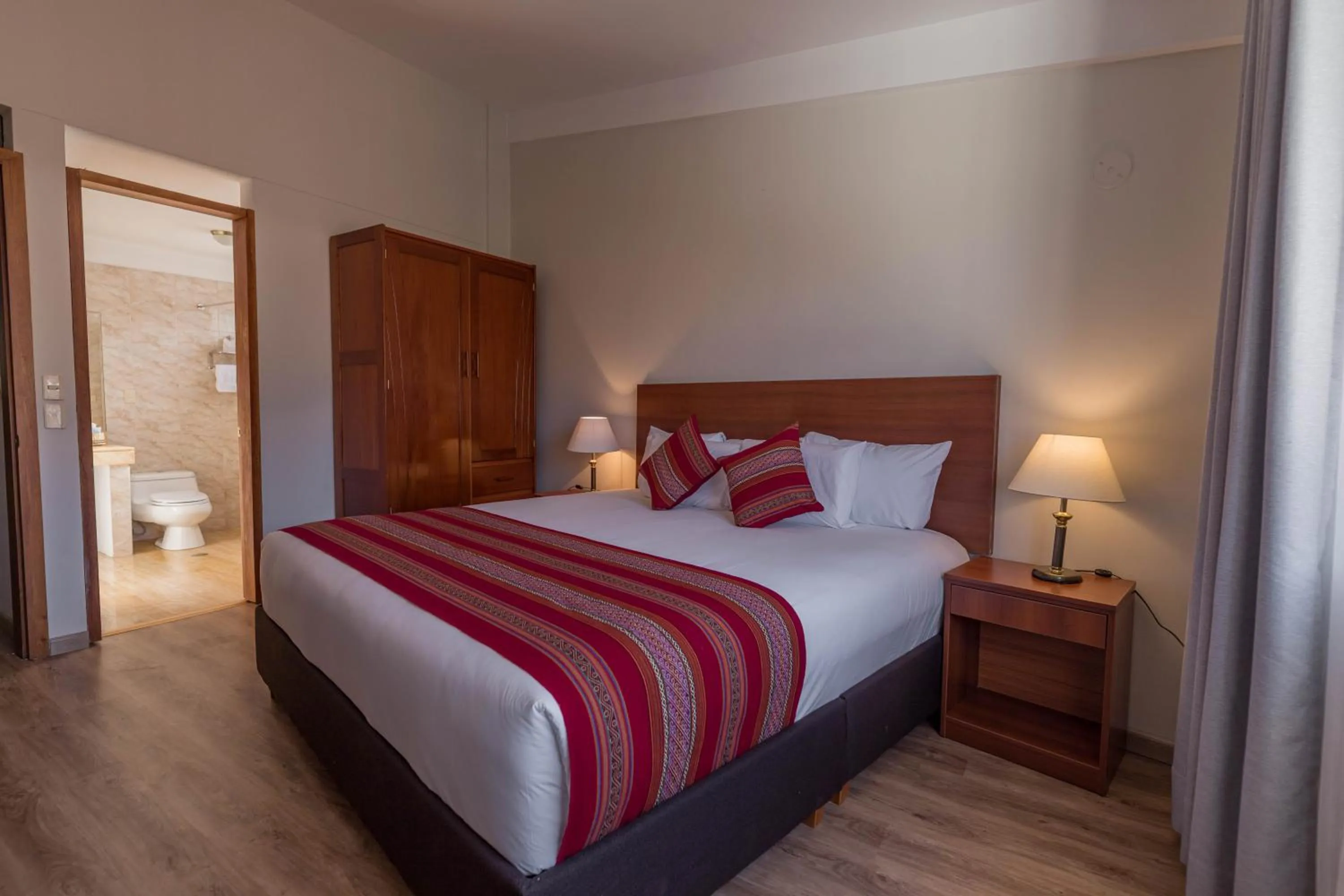 Bed in Quechua Plaza Hotel