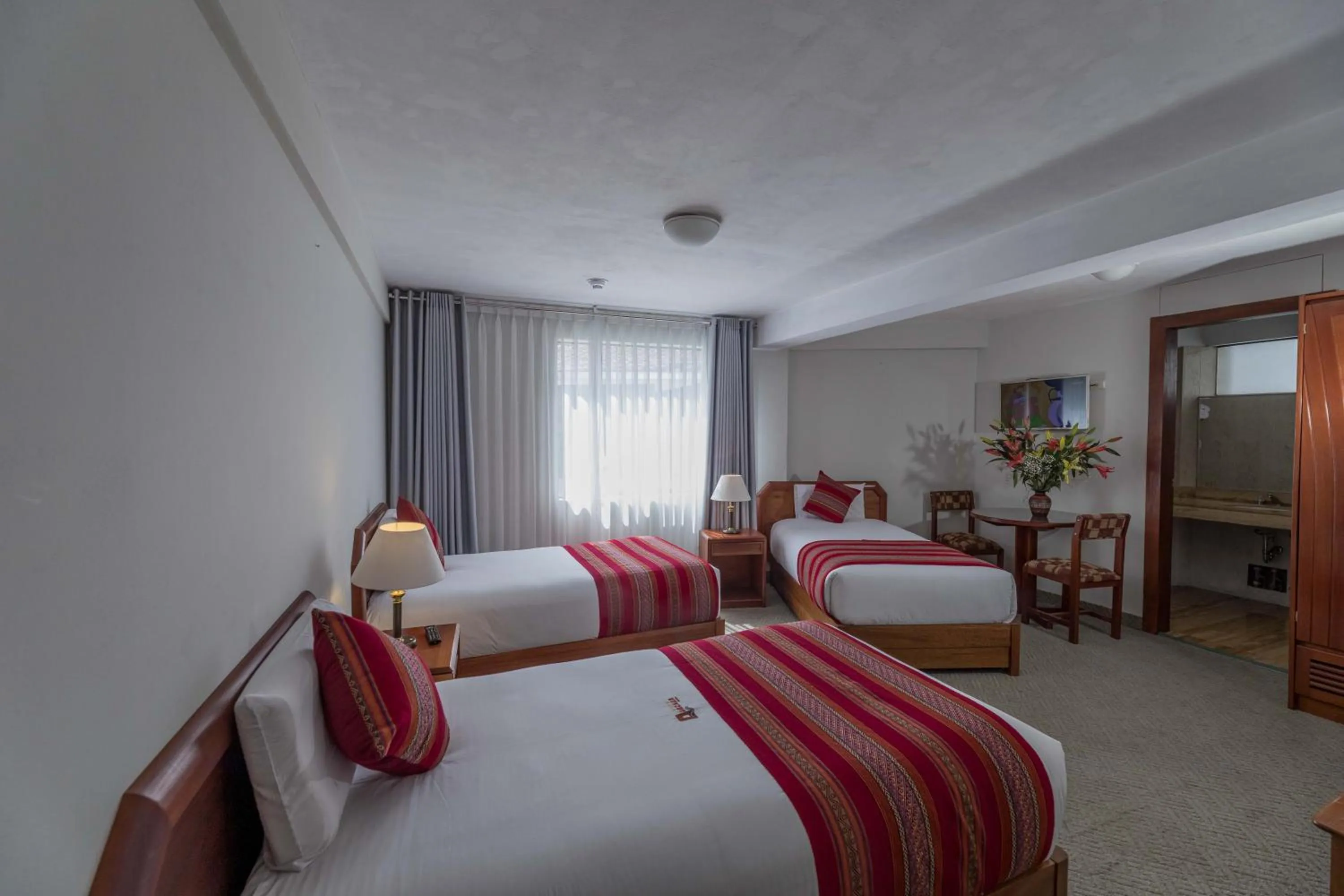 Bed in Quechua Plaza Hotel