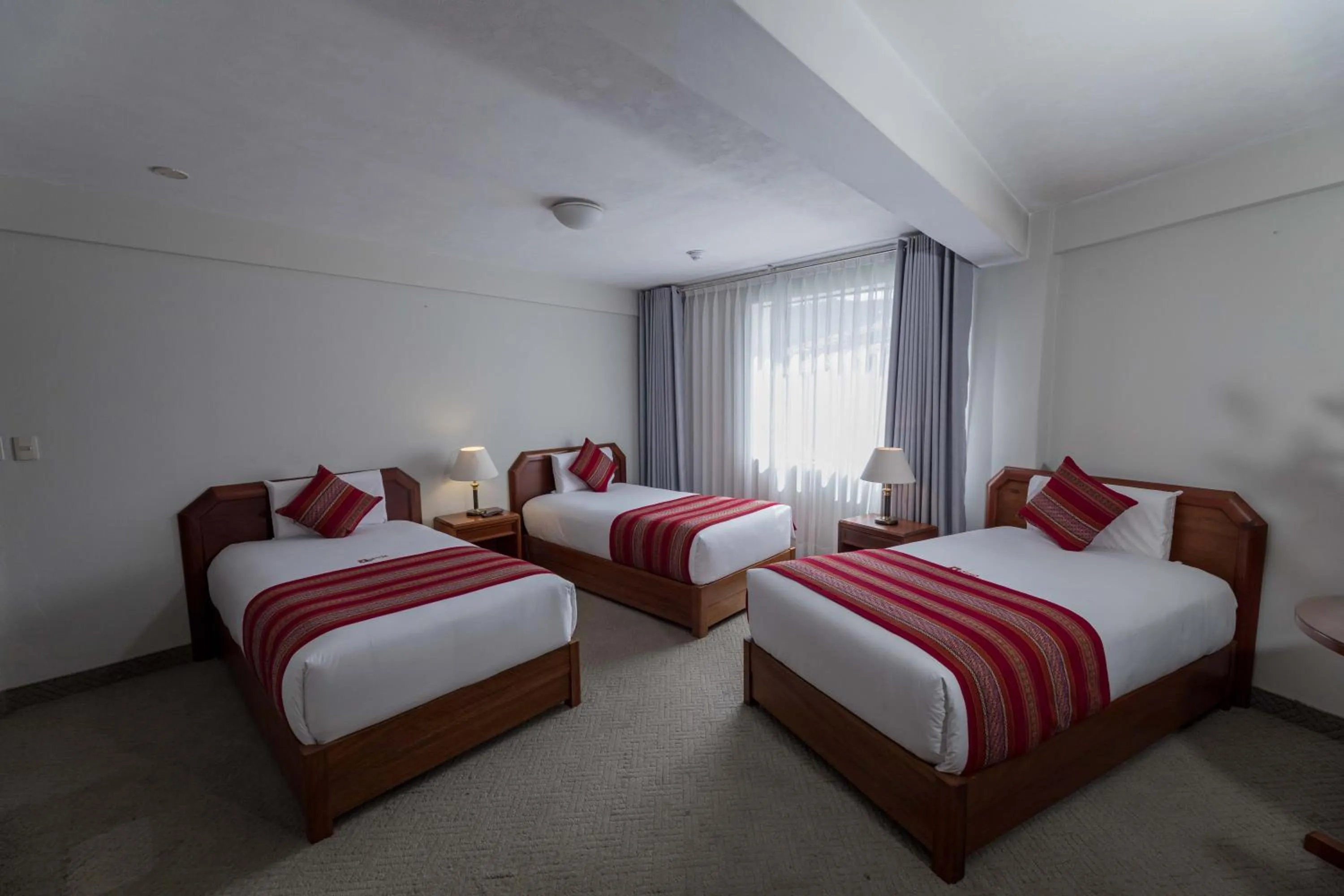 Bed in Quechua Plaza Hotel