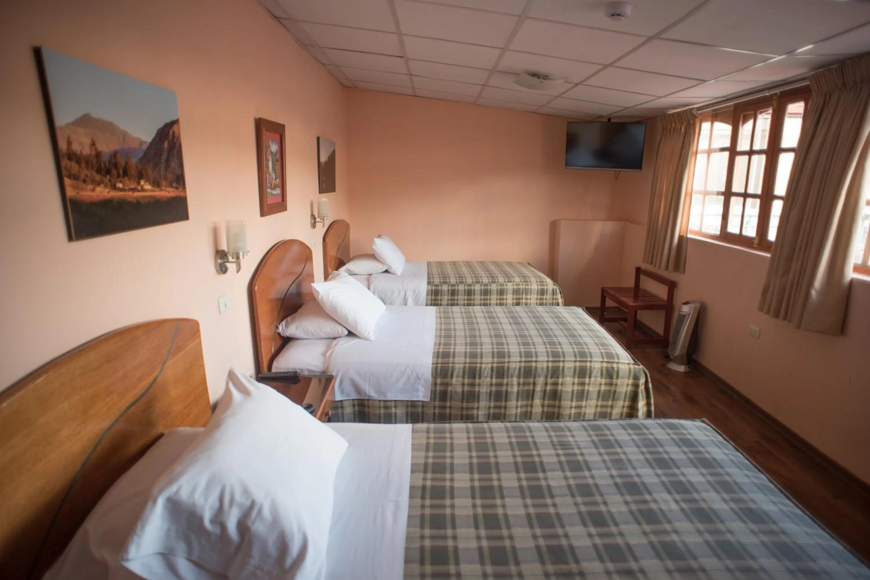 Bed in Hotel Prisma Cusco