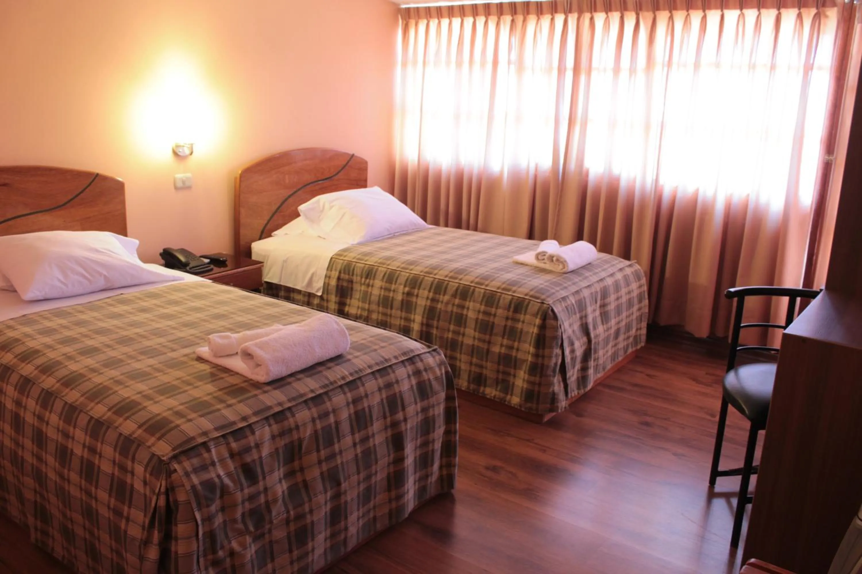 Bed in Hotel Prisma Cusco