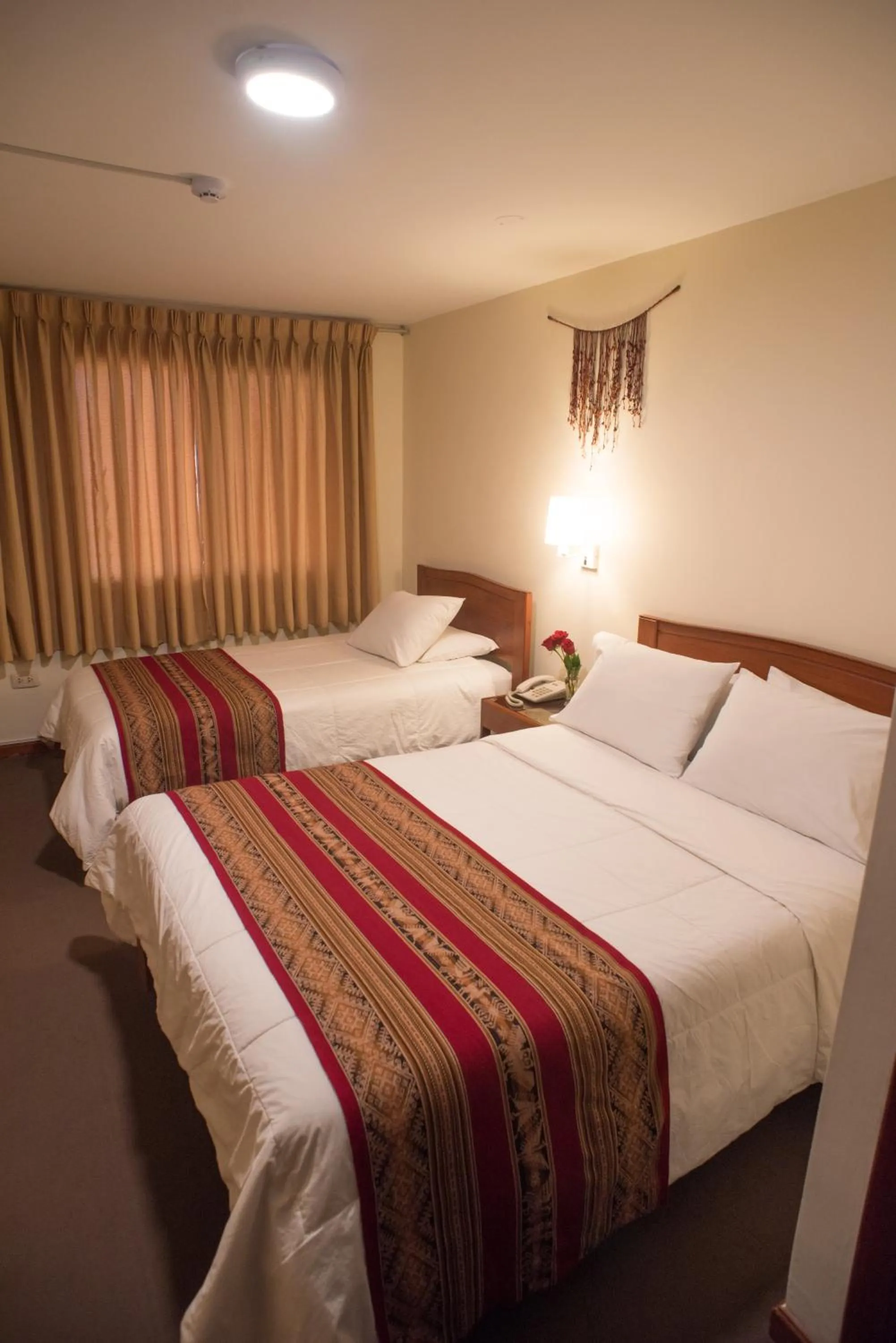 Bed in Hotel Prisma Cusco