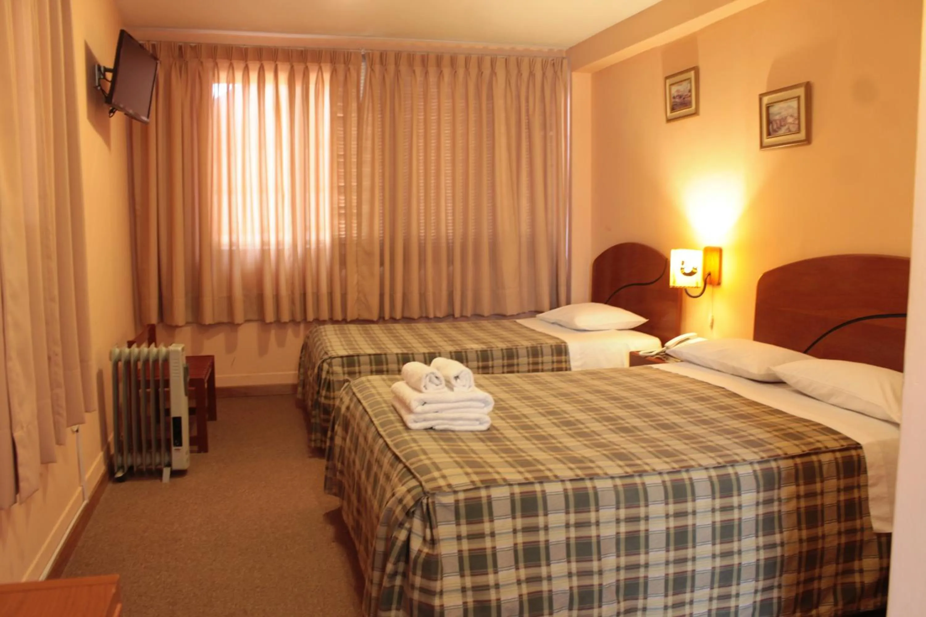 Bed in Hotel Prisma Cusco