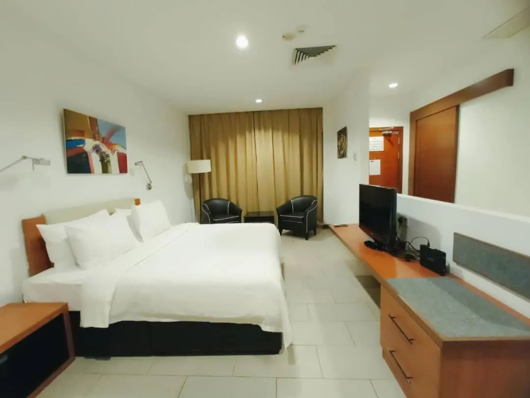 Bed in Gloria Swiss Hotel & Apartment Sandakan