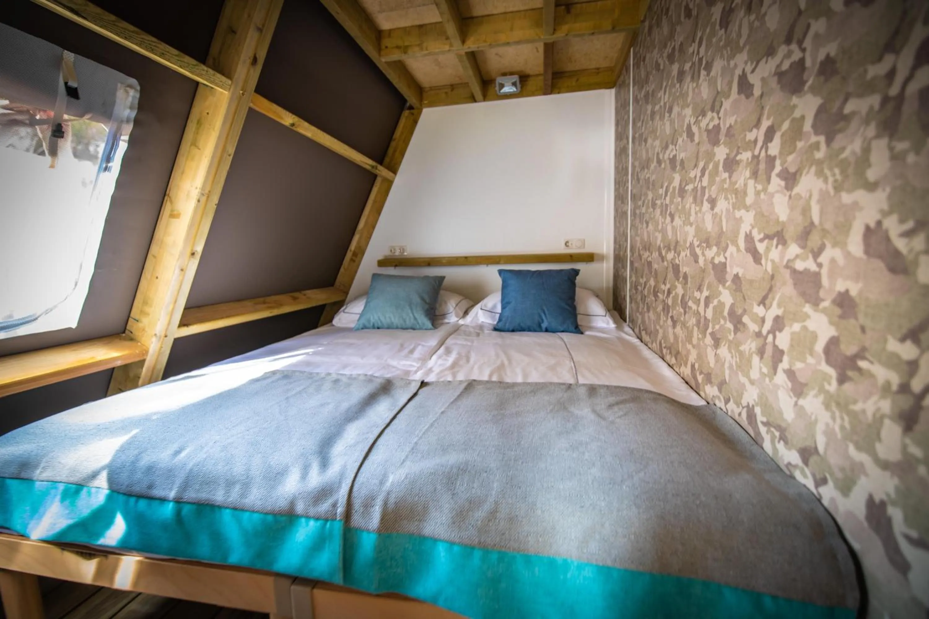 Bed in Arena One 99 Glamping