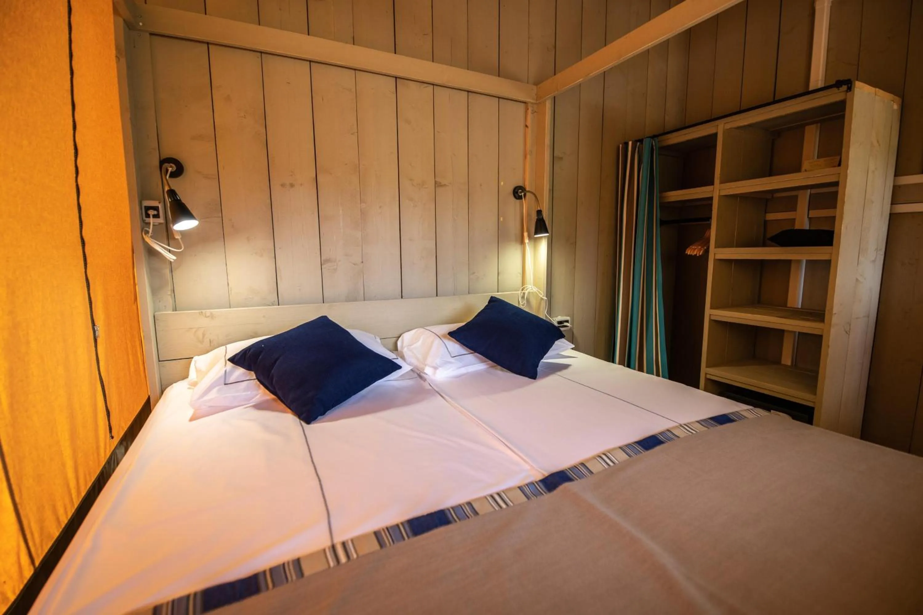 Bed in Arena One 99 Glamping