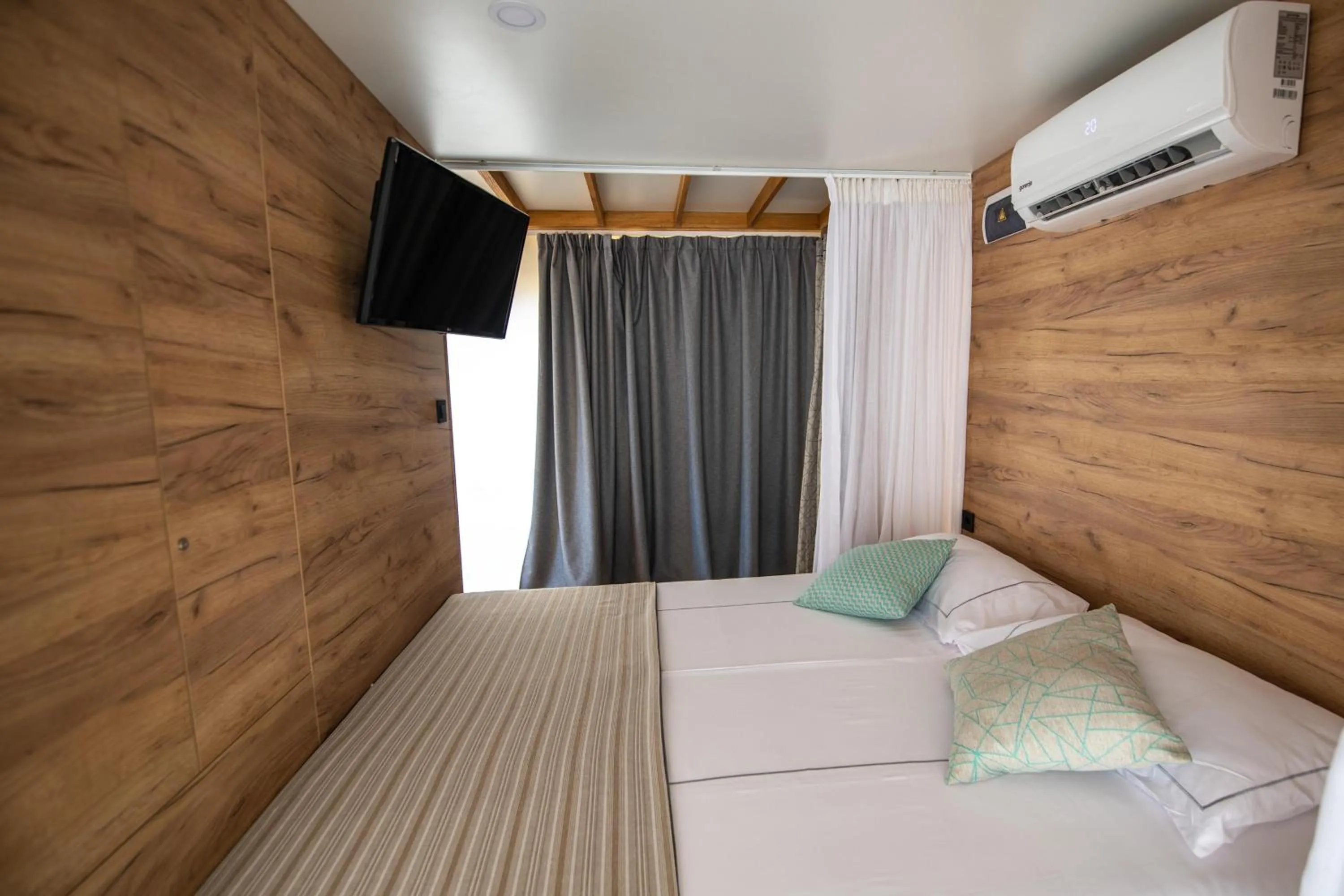 Bed in Arena One 99 Glamping