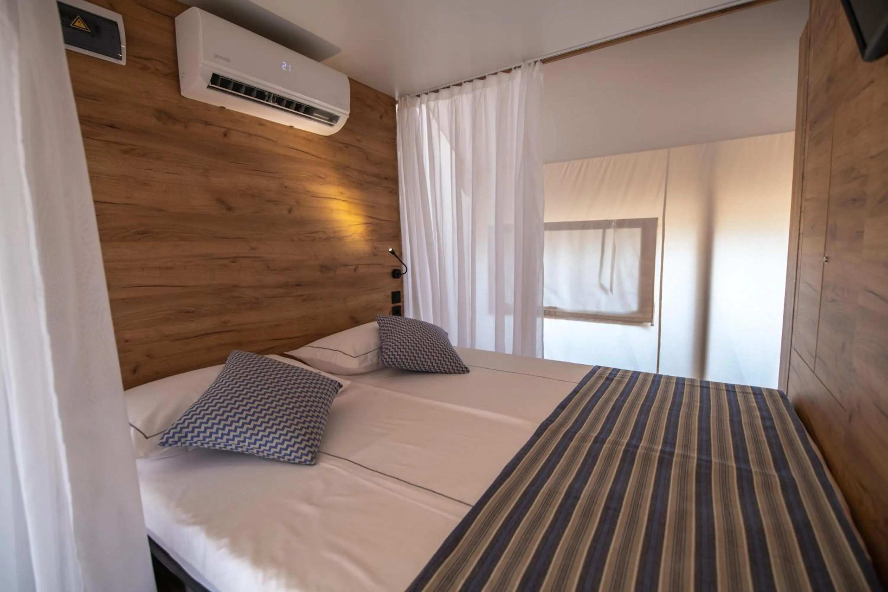 Bed in Arena One 99 Glamping