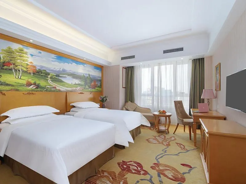 Bed in Vienna Hotel Shandong Qingdao Chengyang