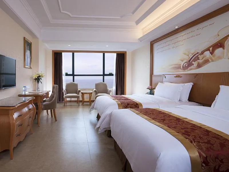 Bed in Vienna International Hotel Guangdong Yangjiang Zapo Travel Avenue