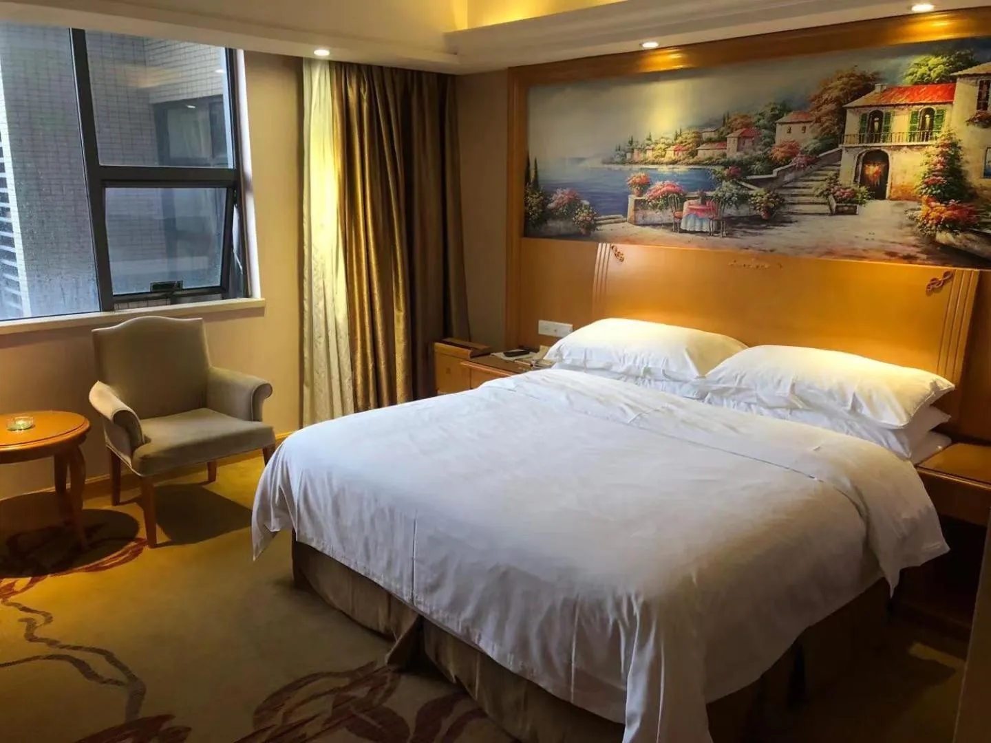 Bed in Vienna International Hotel Guangdong Foshan Nanhai Heshun