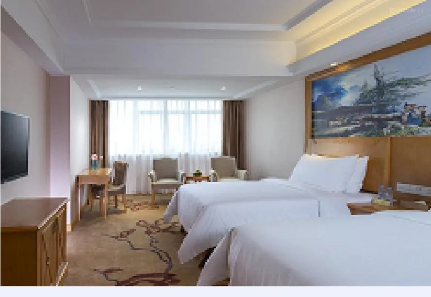 Bed in Vienna International Hotel Guangdong Foshan Nanhai Heshun
